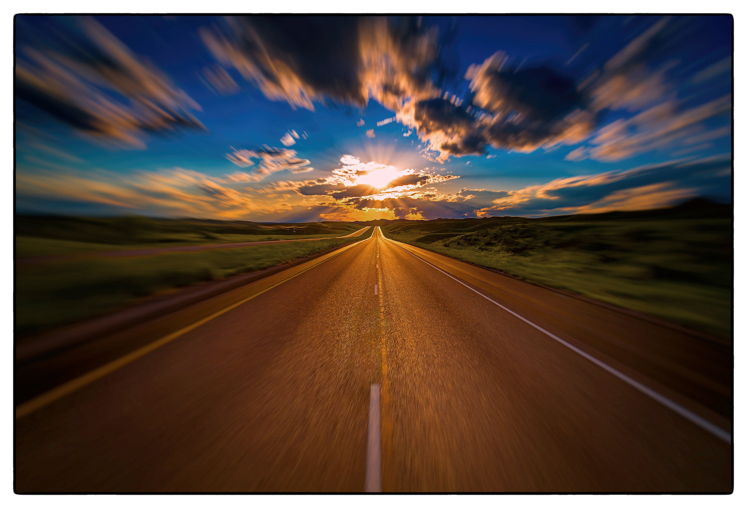 a-brilliant-sun-sets-over-the-i90-highway-in-wyoming-usa