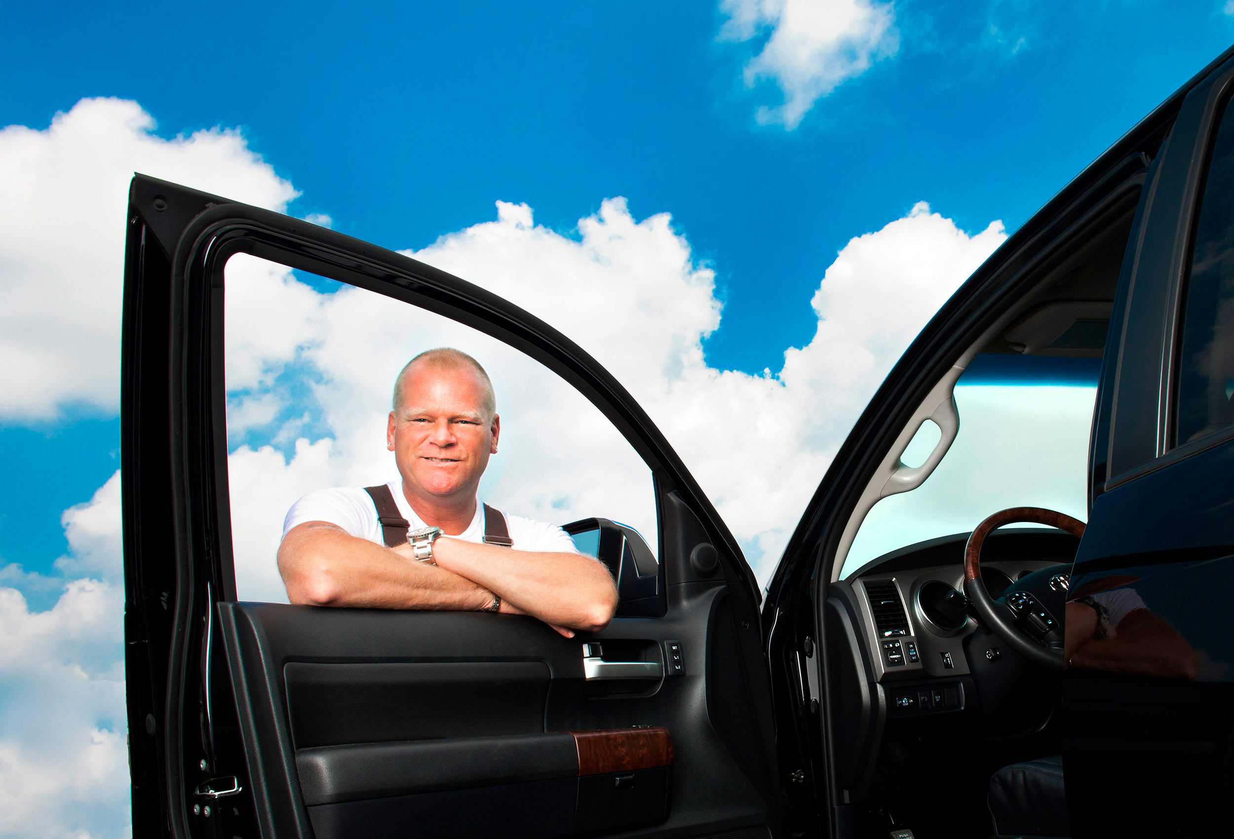 tv celebrity mike holmes poses through the window of his toyota truck in toronto 