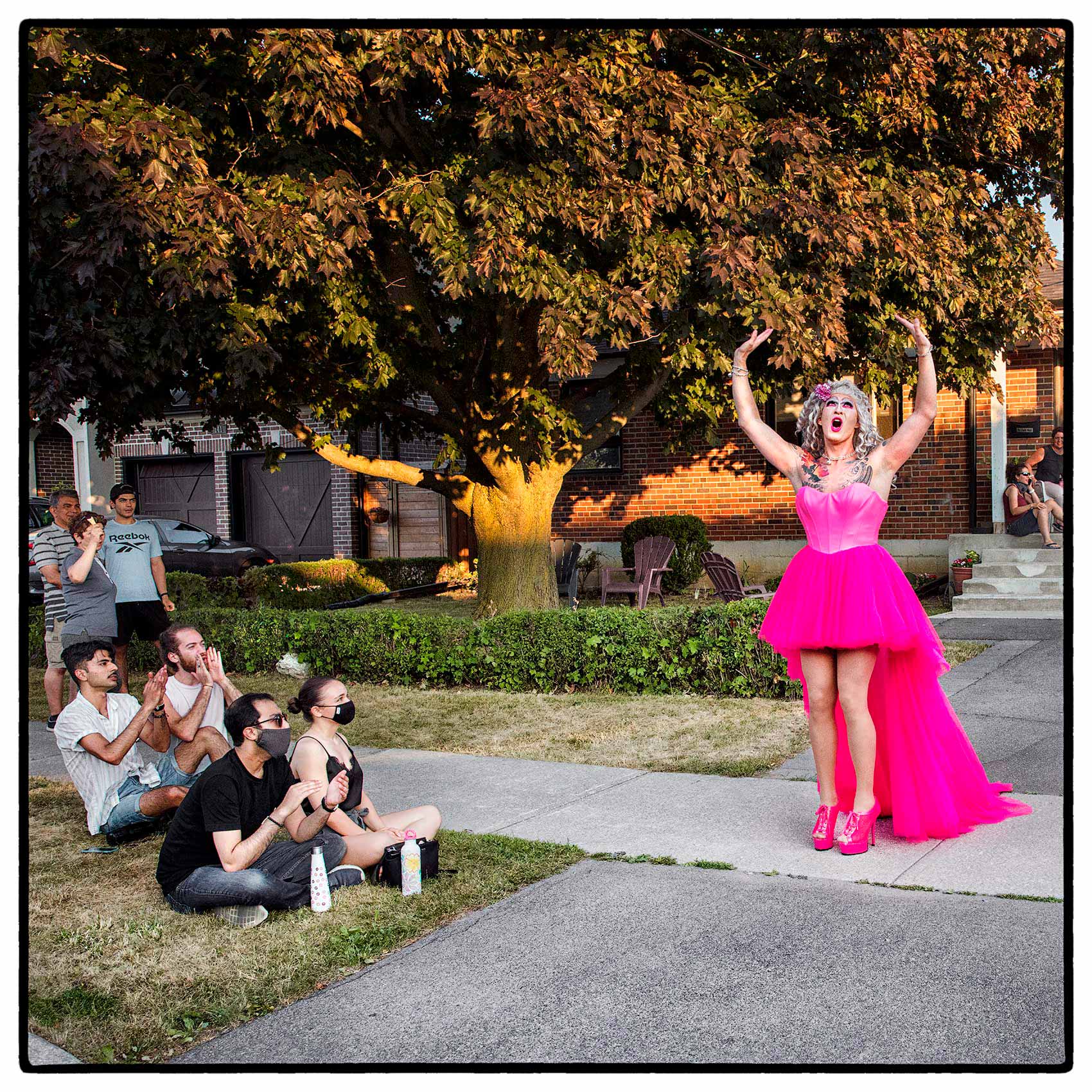 A drag queen performing outside for her neighbors in north york 