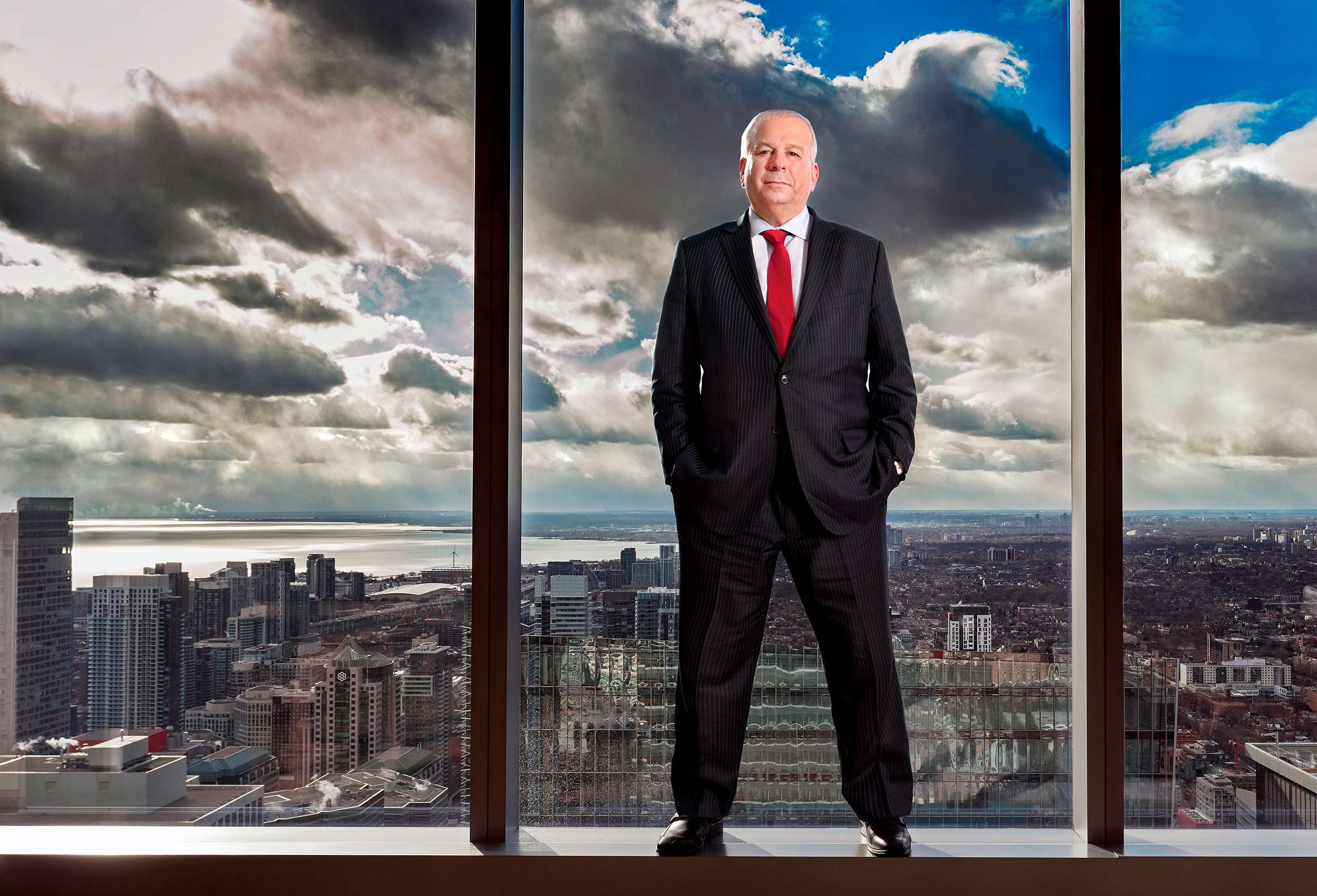 economist david rosenberg  stands in his downtown toronto office with the city skyline behind him