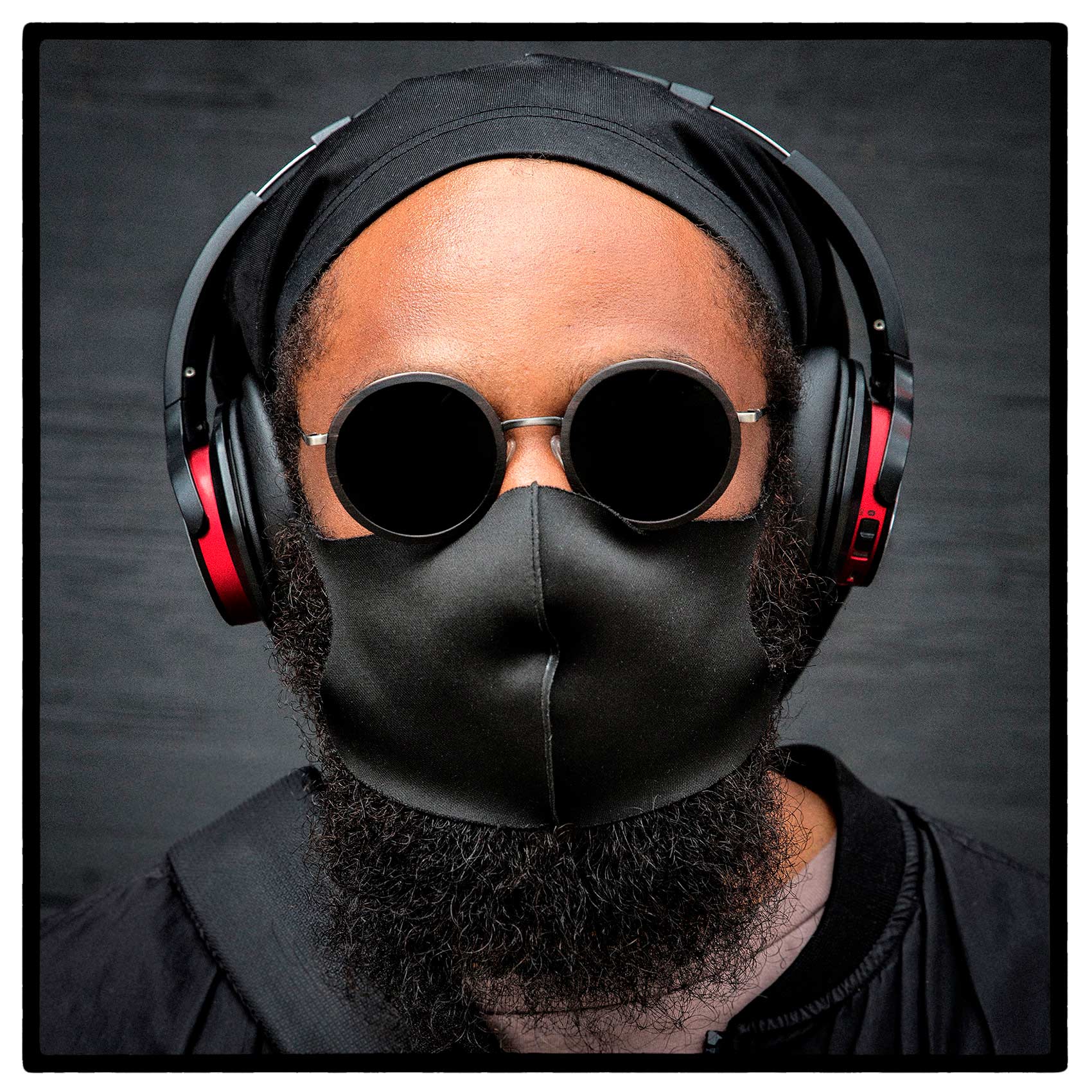 a futuristic looking man with his mask  and sunglasses during the covid 19 pandemic in toronto