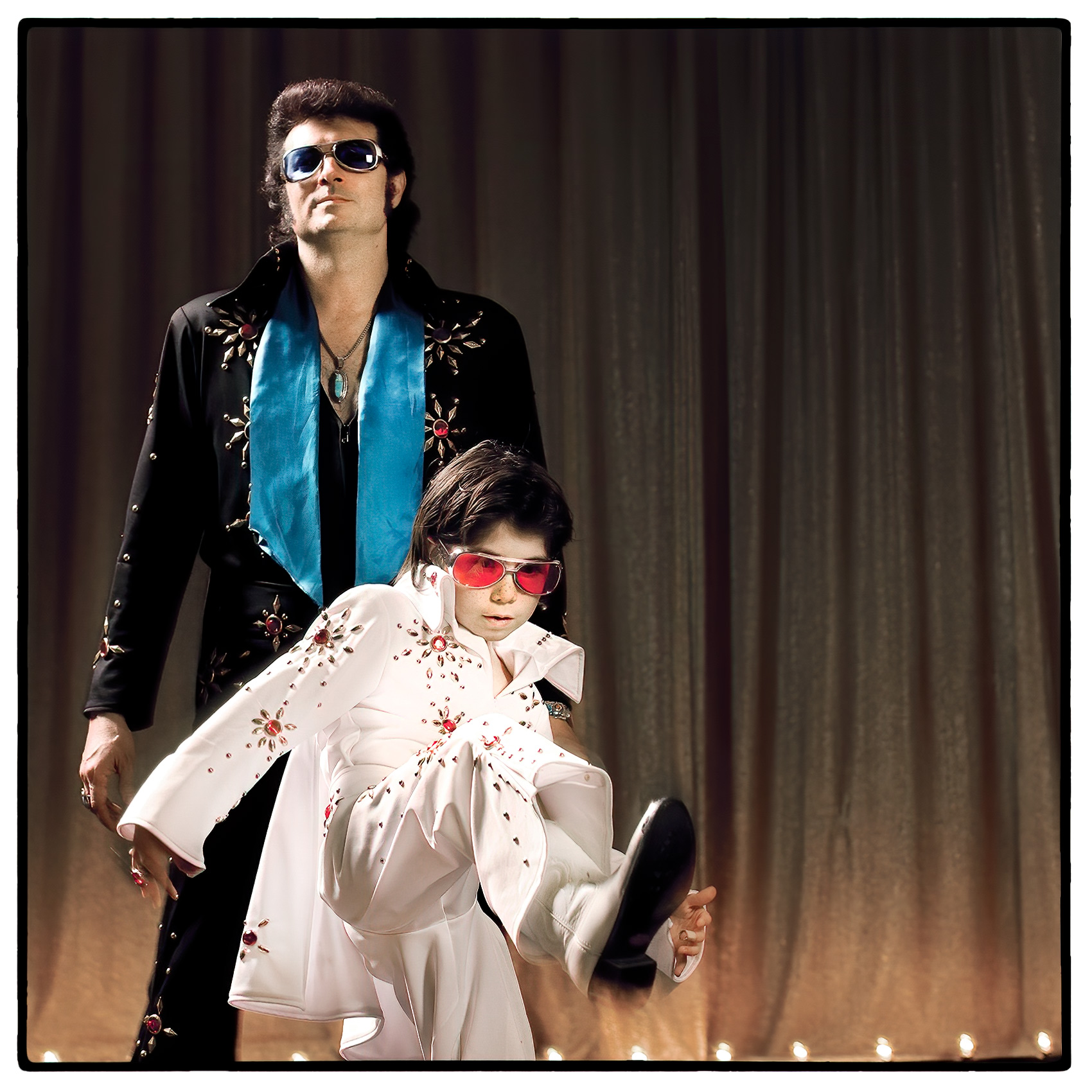 a-boy-and-a-man-who-are-elvis-impersonators-in-las-vegas