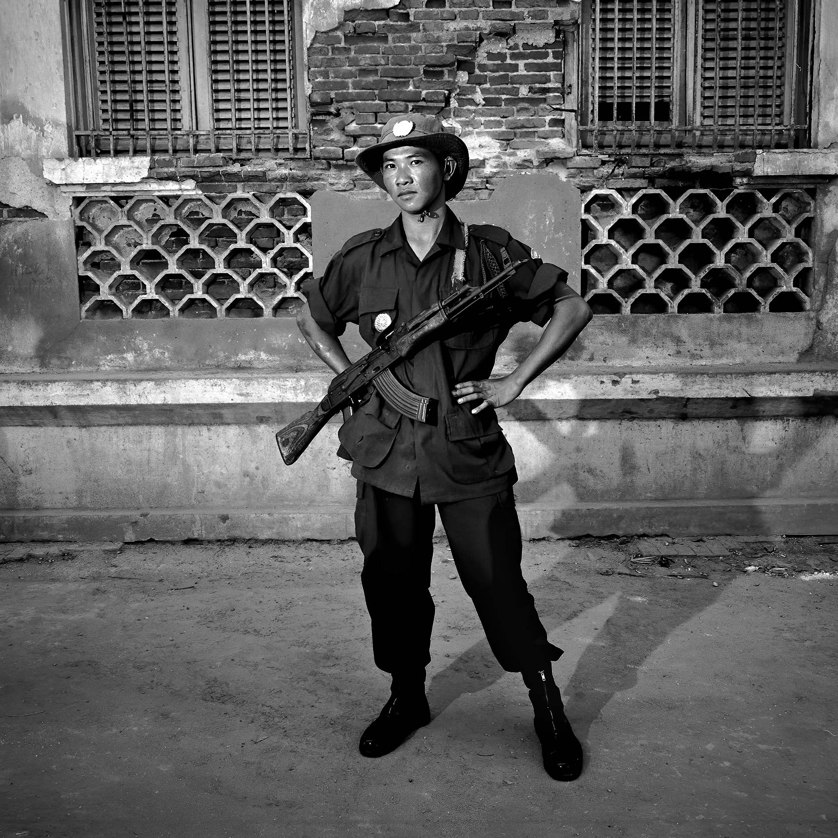 a-cambodian-solider-poses-for-a-photo-with-an-ak-47-in-phnom-penh