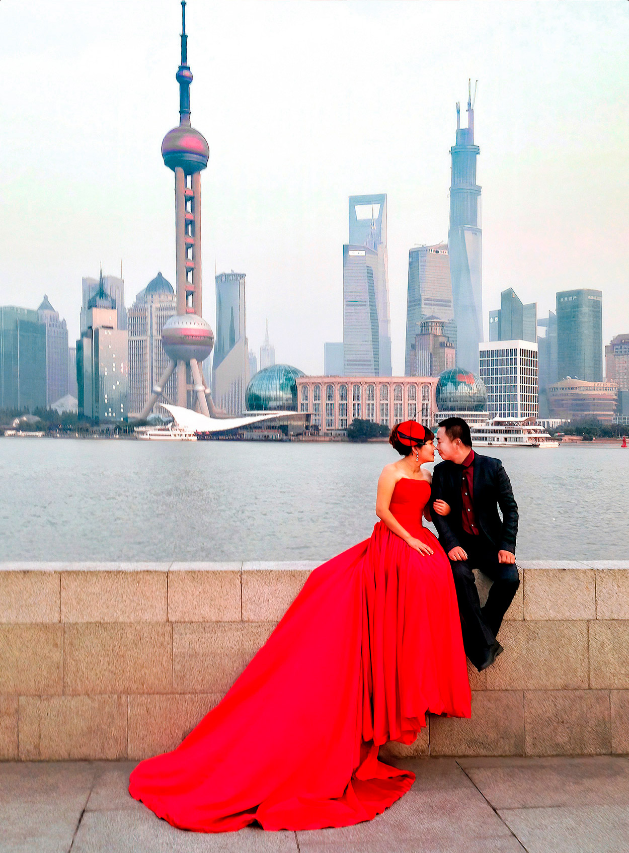 a-chinese-couple-pose-for-pre-wedding-photos-at-sunset-along-the-pudong-in-shanghai