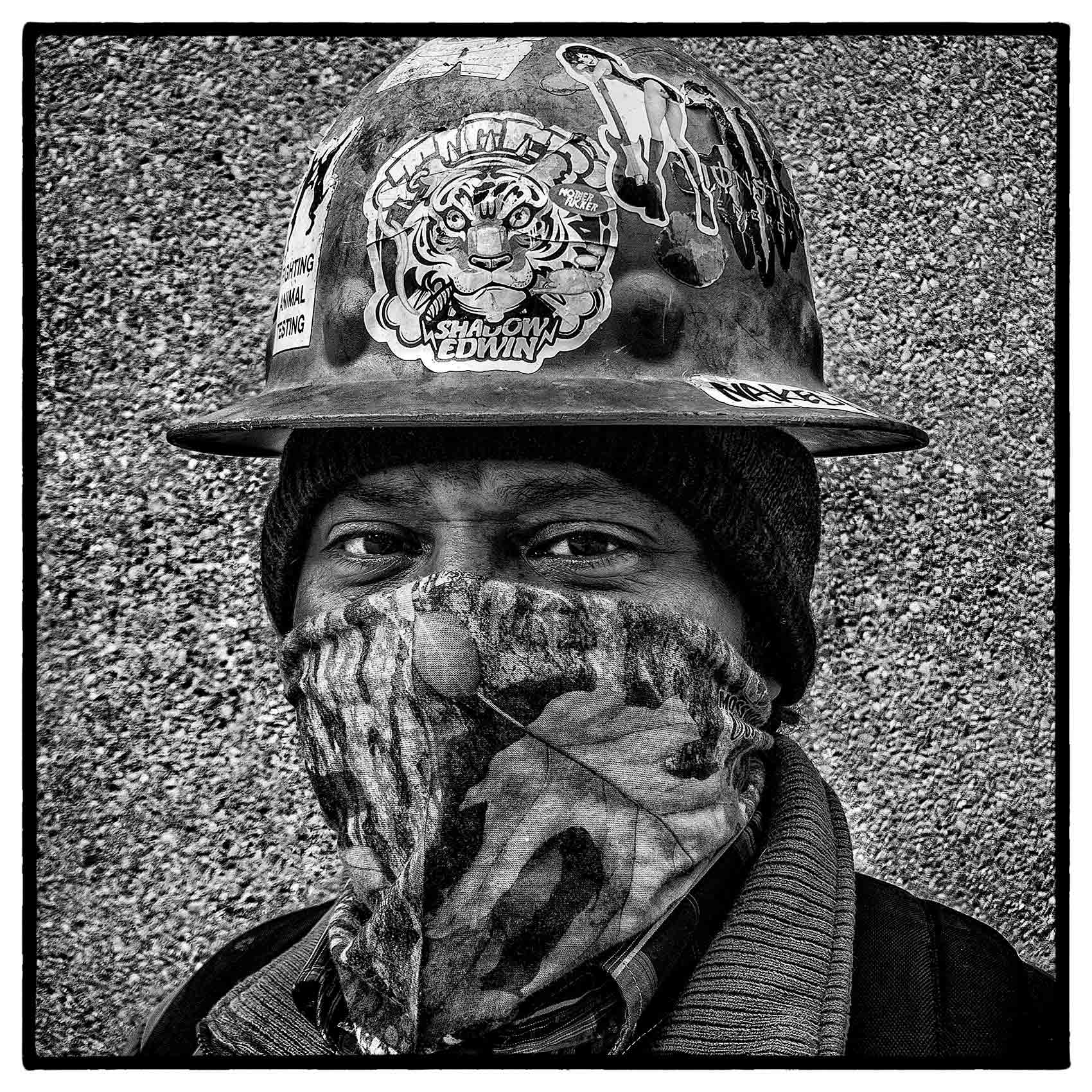 a steel worker shows off his modified facemask during the start of the pandemic in toronto