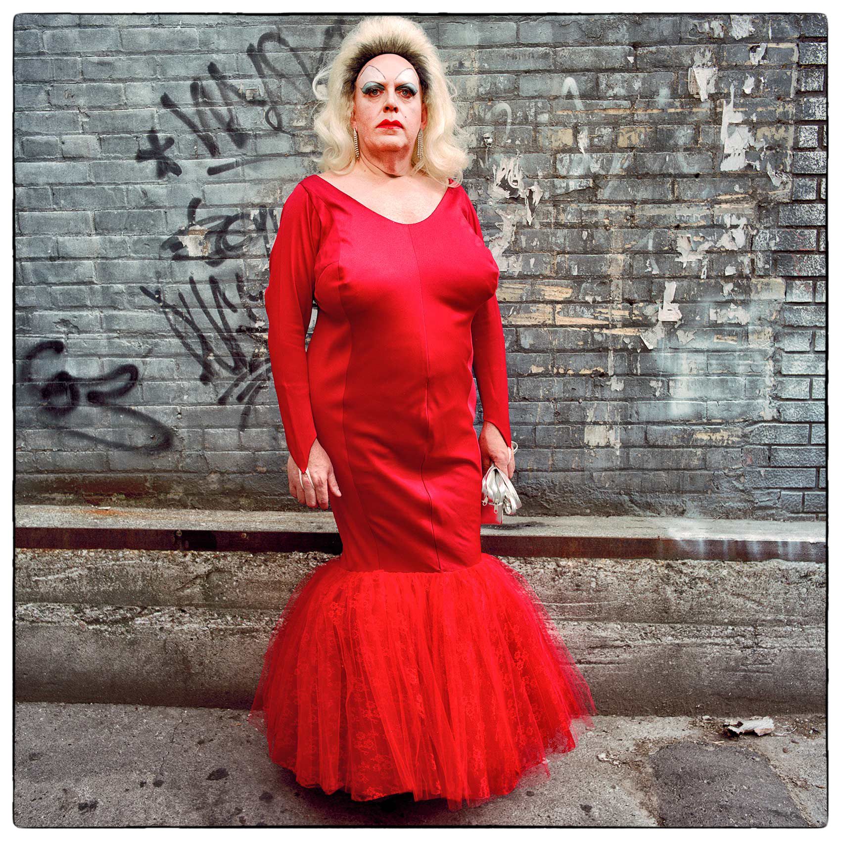 a-drag-queen-poses-for-a-photo-in-an-alleyway-during-toronto-pride