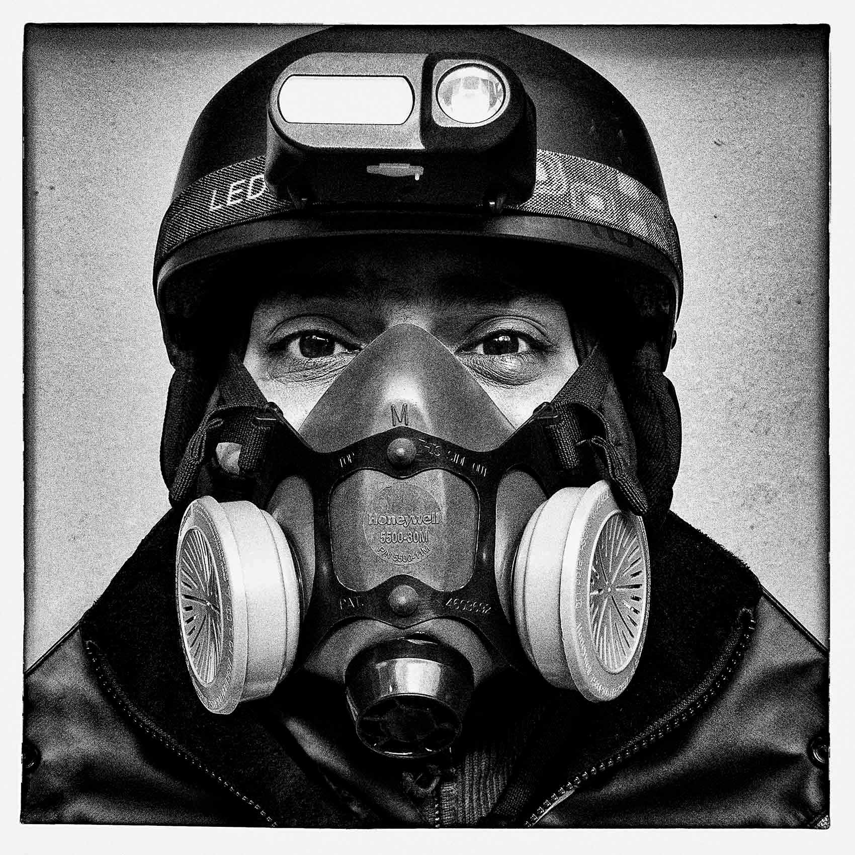 a toronto food courier wears a full face mask while working during the pandemic 
