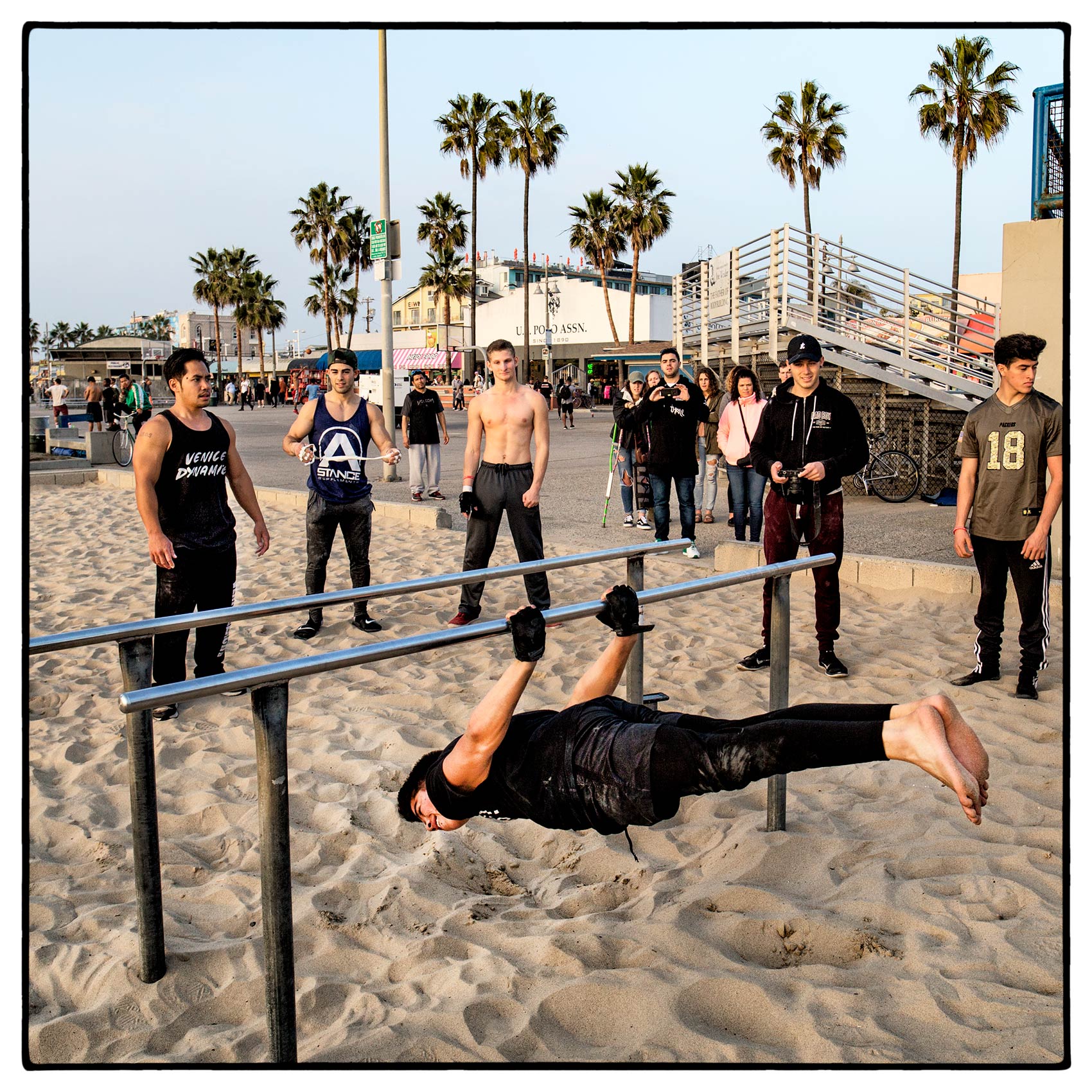 a-group-of-boys-practice-their-gymnastics-on-venice-beach-california-2