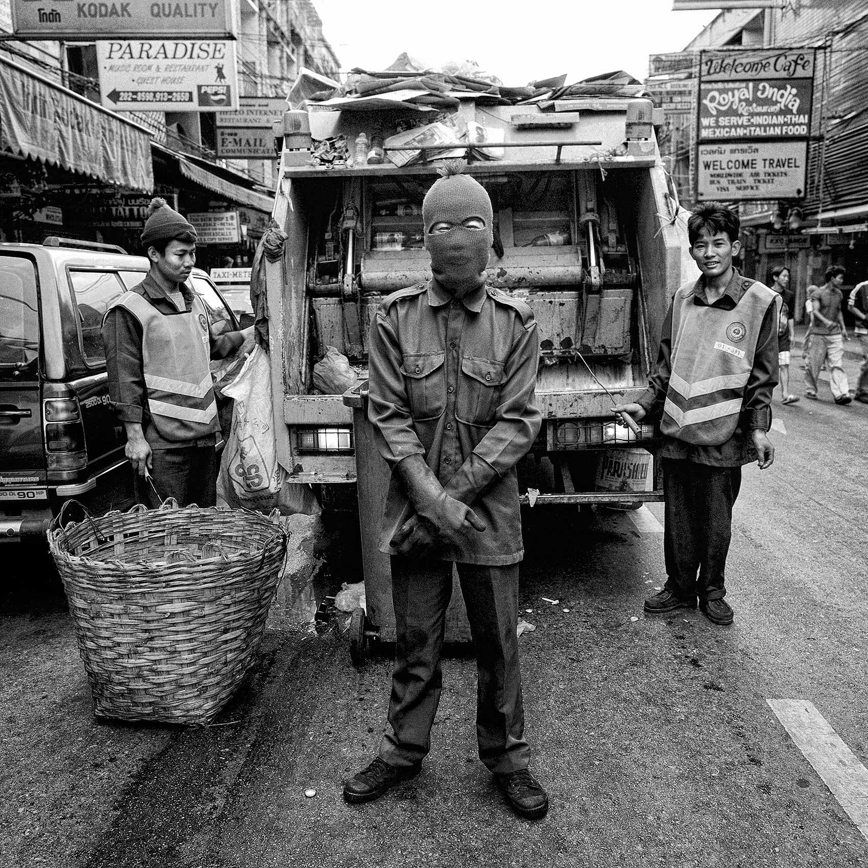 a-group-of-garbagemen-pose-for-a-photo-on-the-streets-of-bangkok-thailand