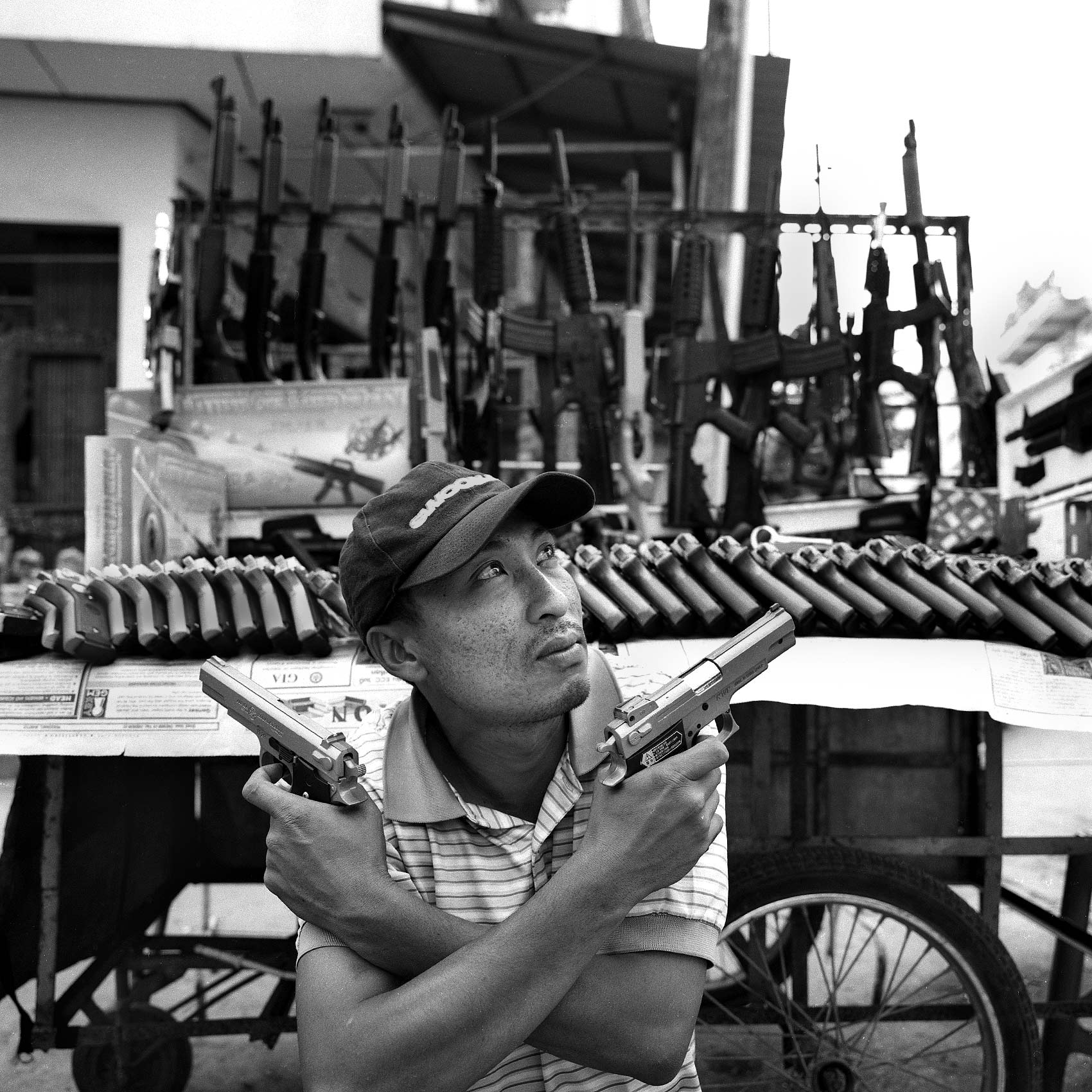 a-gun-dealer-on-the-streets-of-tachileik-burma