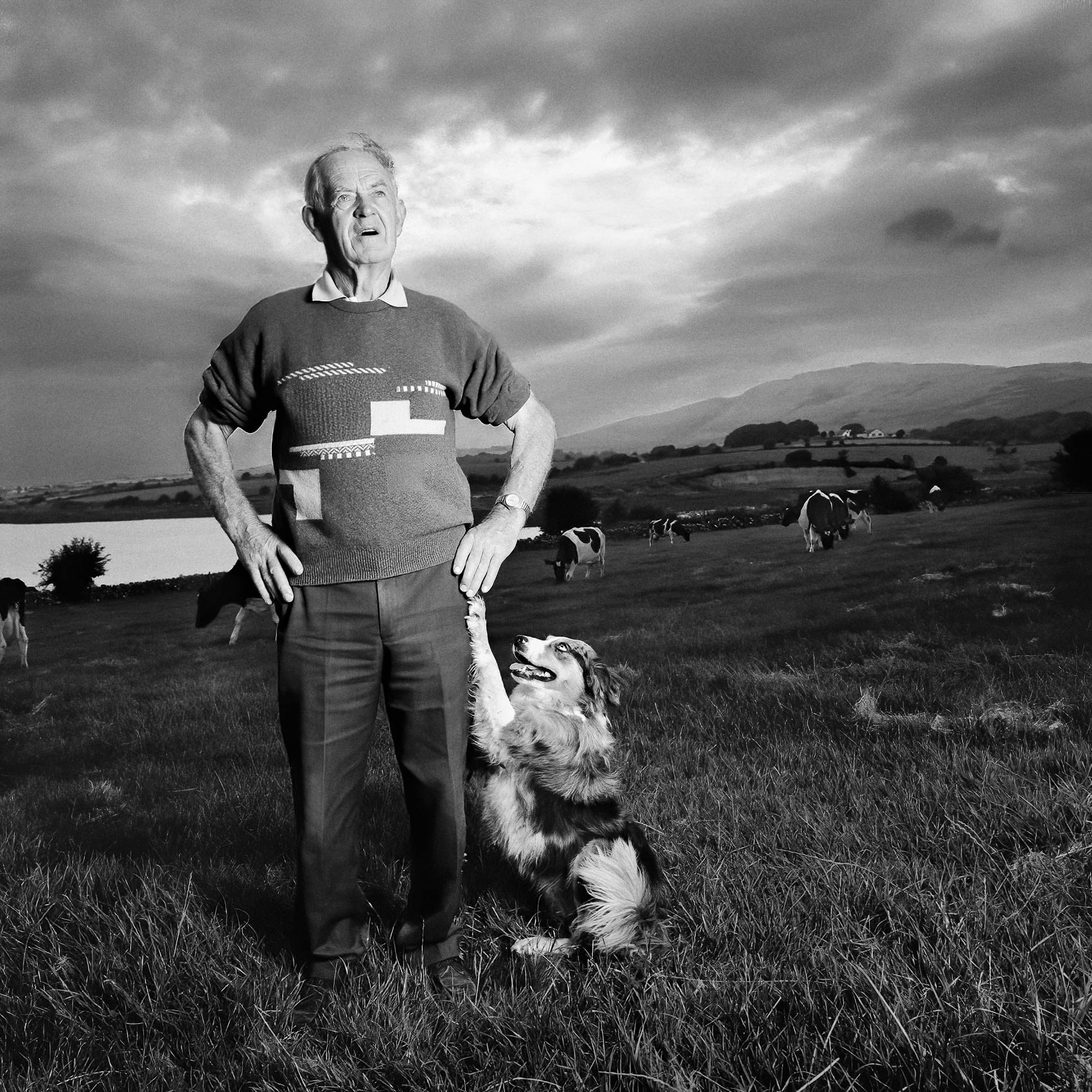 a-irish-farmer-poses-for-a-photo-with-his-trusted-sheep-dog-by-his-side-at-their-farm-outside-of-cork-ireland