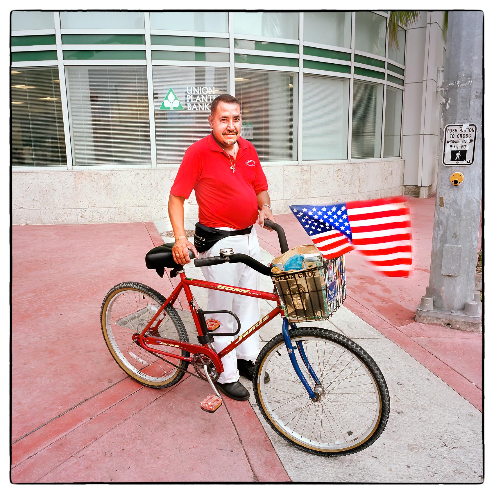 a-man-in-miami-poses-for-a-photo-with-his-bicycle-in-the-downtown-area