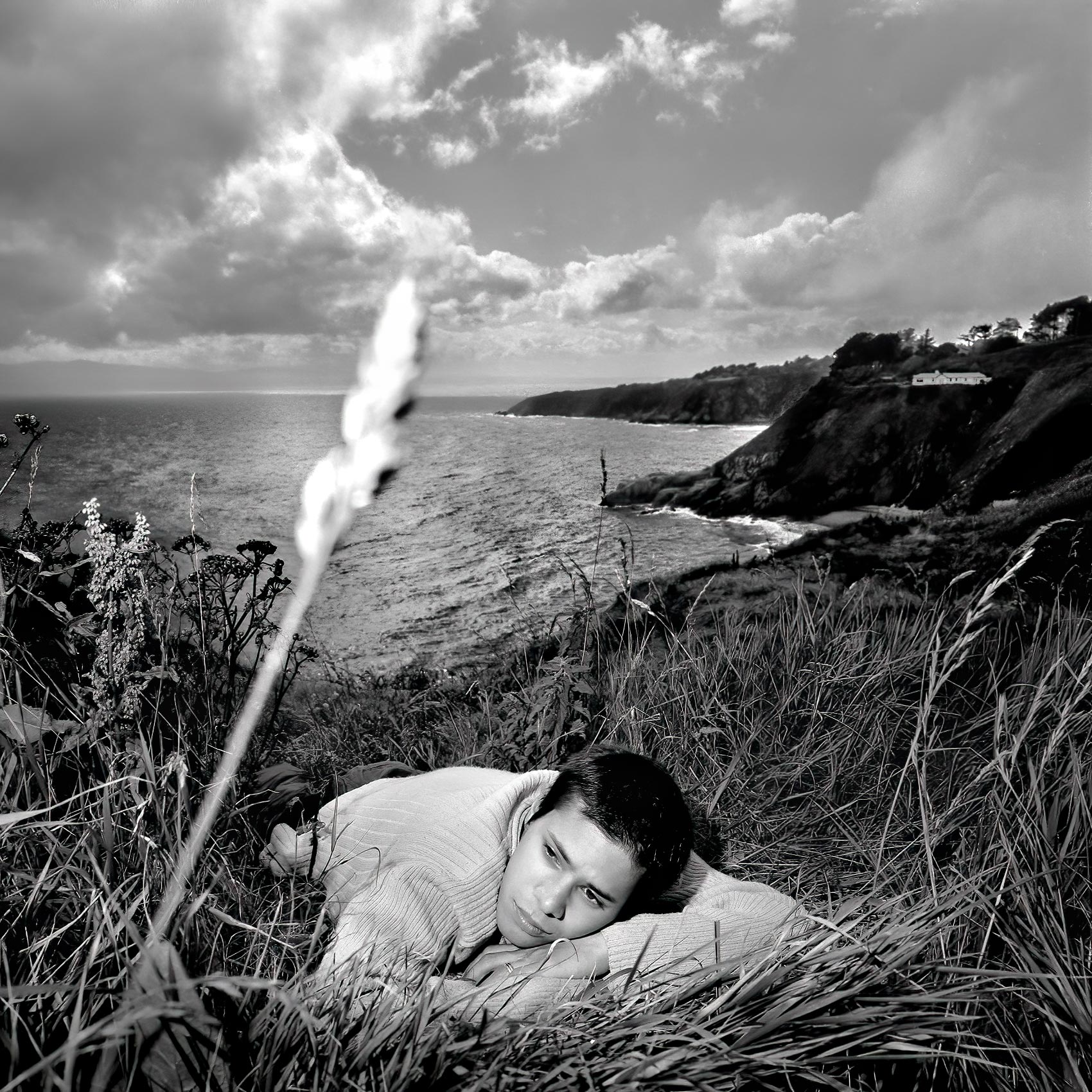 ebehard-schonleays-from-berlin-lays-on-a-hillside-near-the-light-house-in-howth-ireland-with-the-bay-of-dublin-behind-him