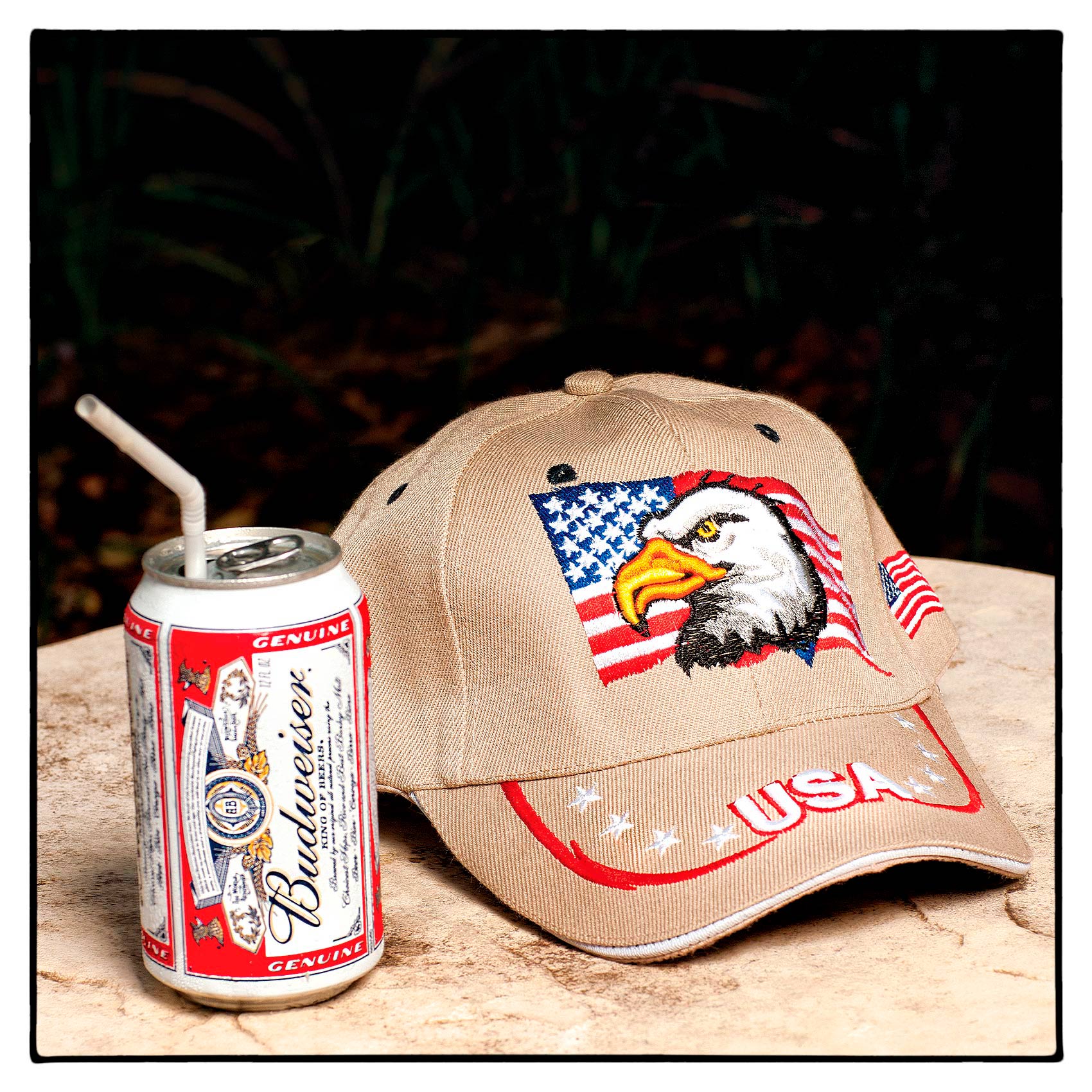 a-budweiser-beer-can-and-a-ball-cap-with-a-us-flag-and-eagle-sit-on-a-hotel-table-in-florida