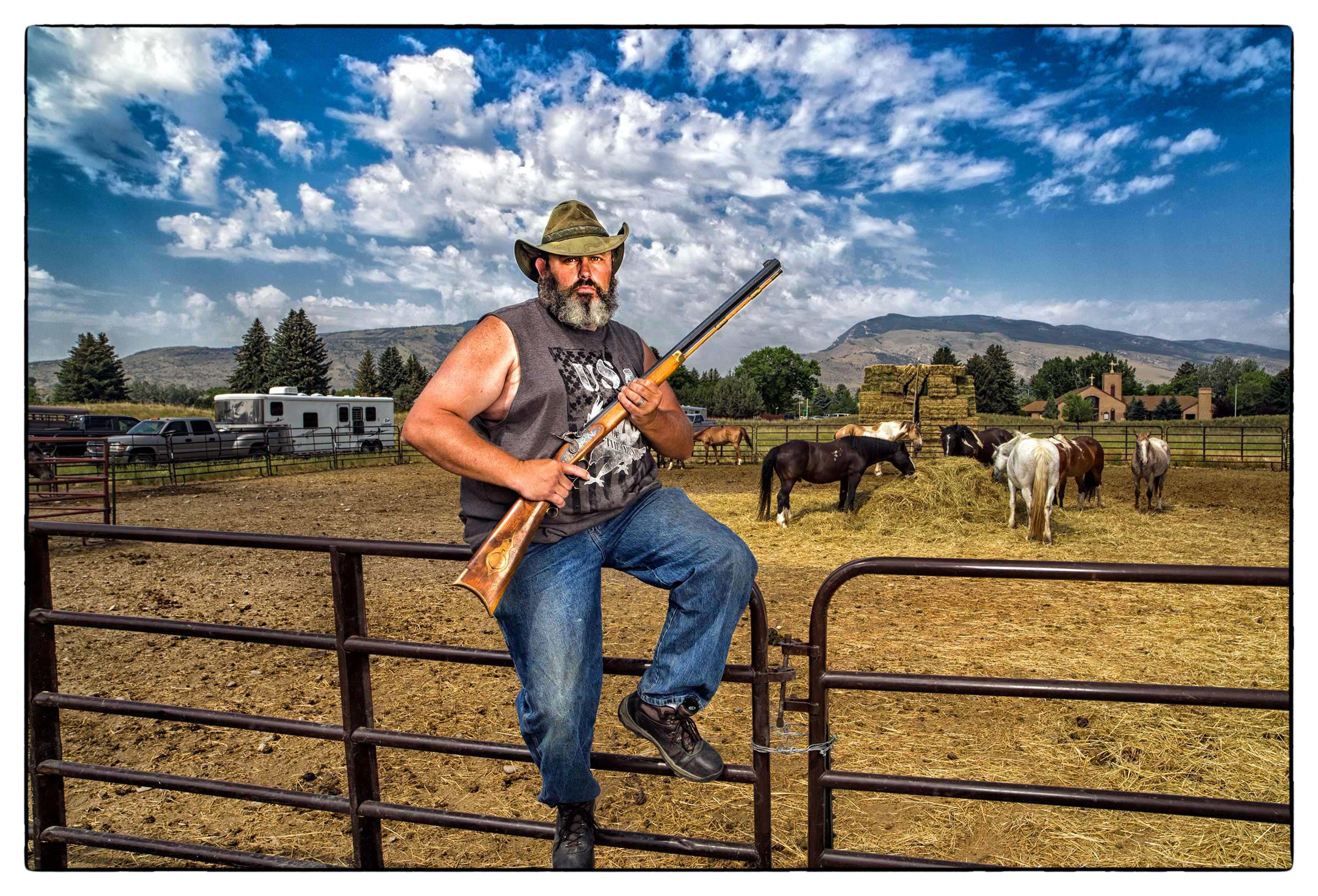 a-portrait-of-a-modern-day-cowboy-and-his-rifle-in-cody-wyoming