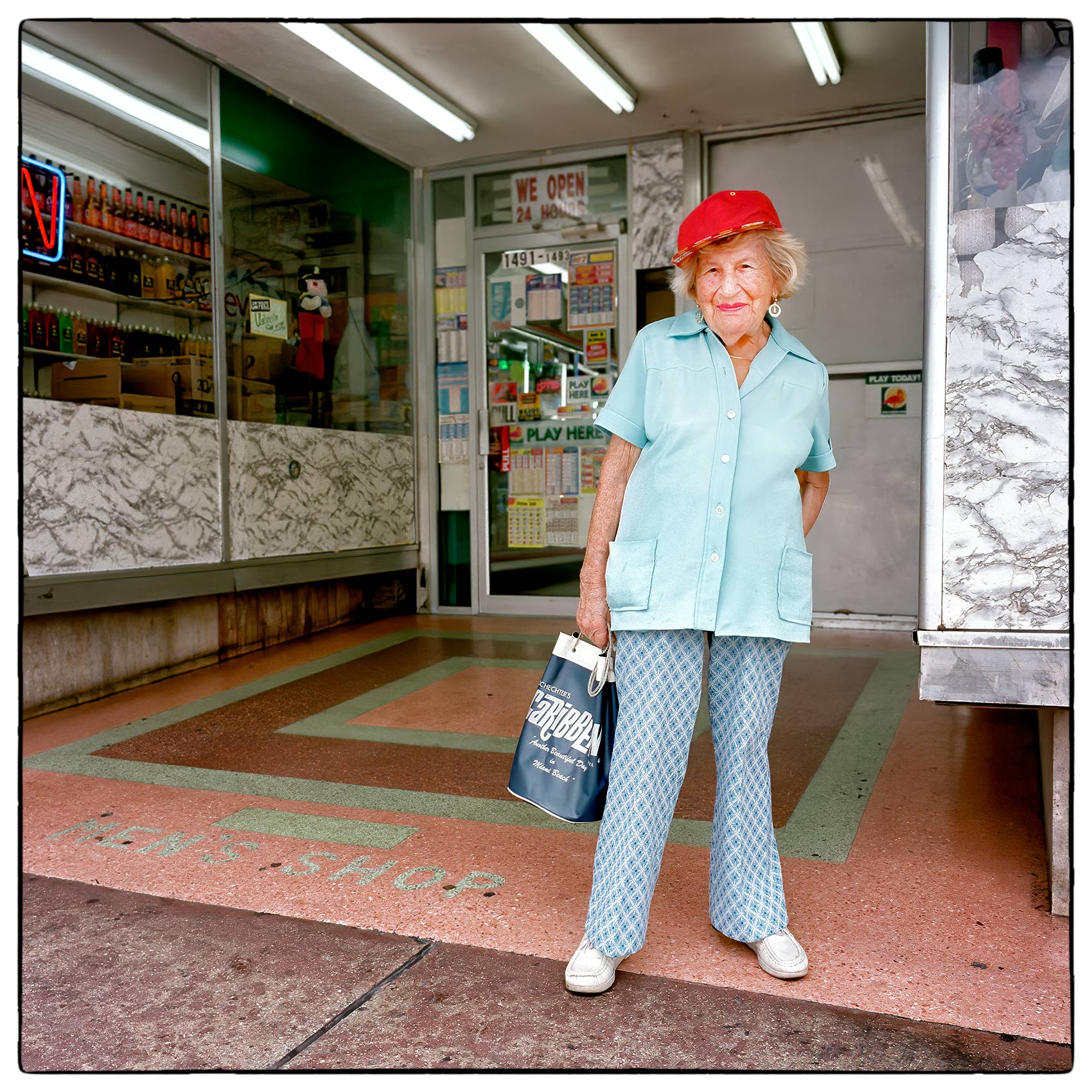 a-retired-woman-poses-for-a-photo-outside-a-convenience-store-near-her-condominium-in-miami-florida