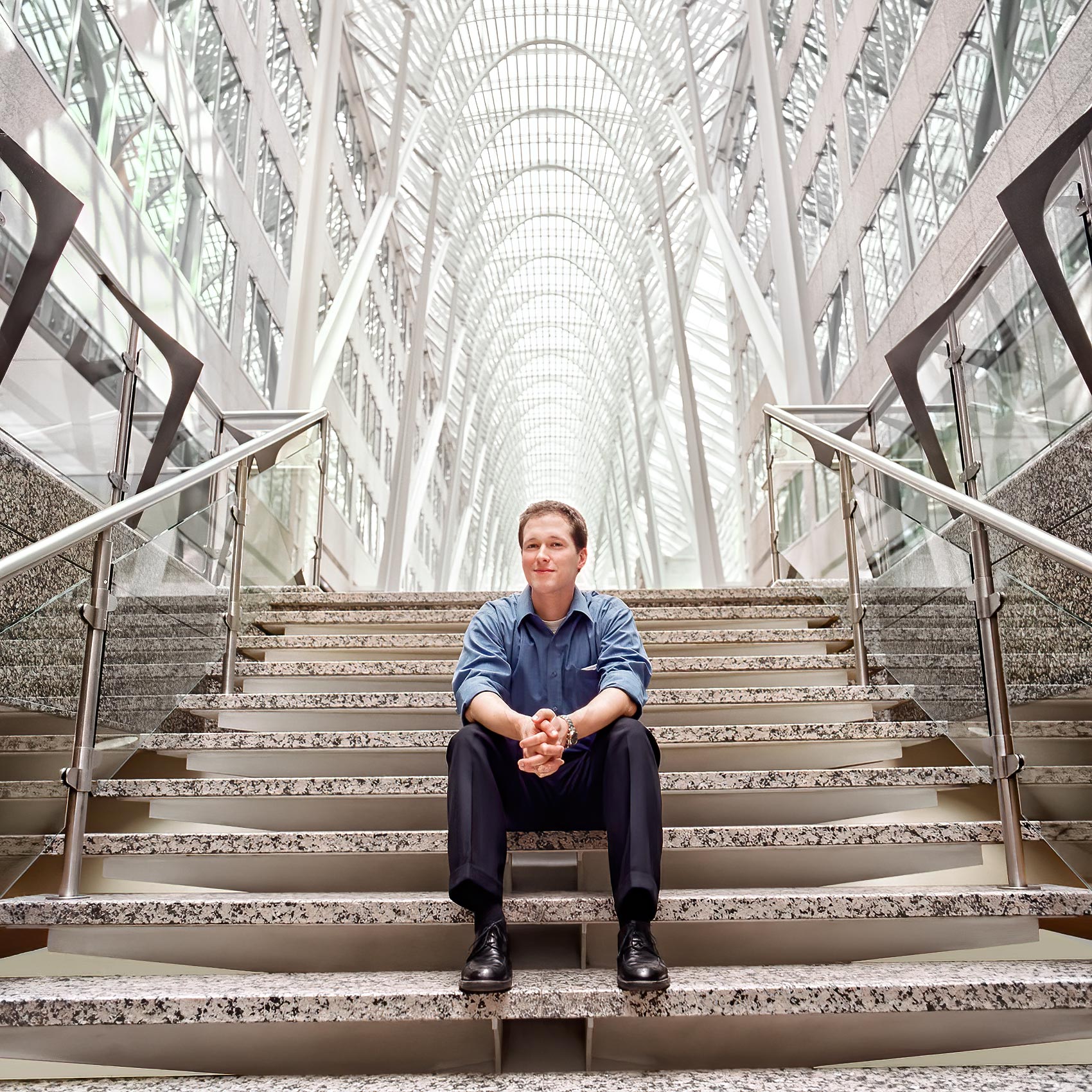 a rotman graduate poses for a professional business portrait at brookfield place in toronto