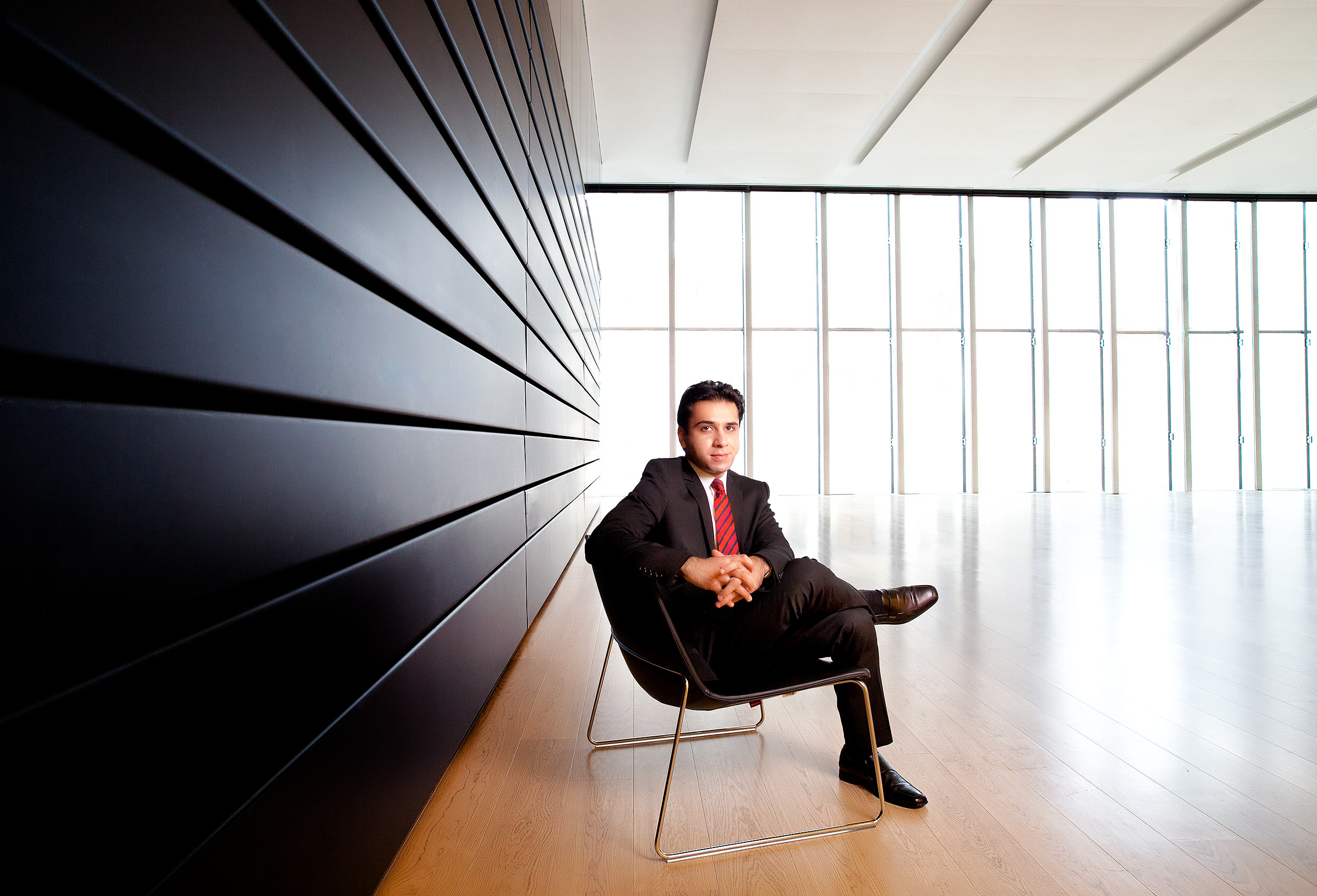 a rotman mba student poses for a corporate portrait inside the schools toronto lecture hall