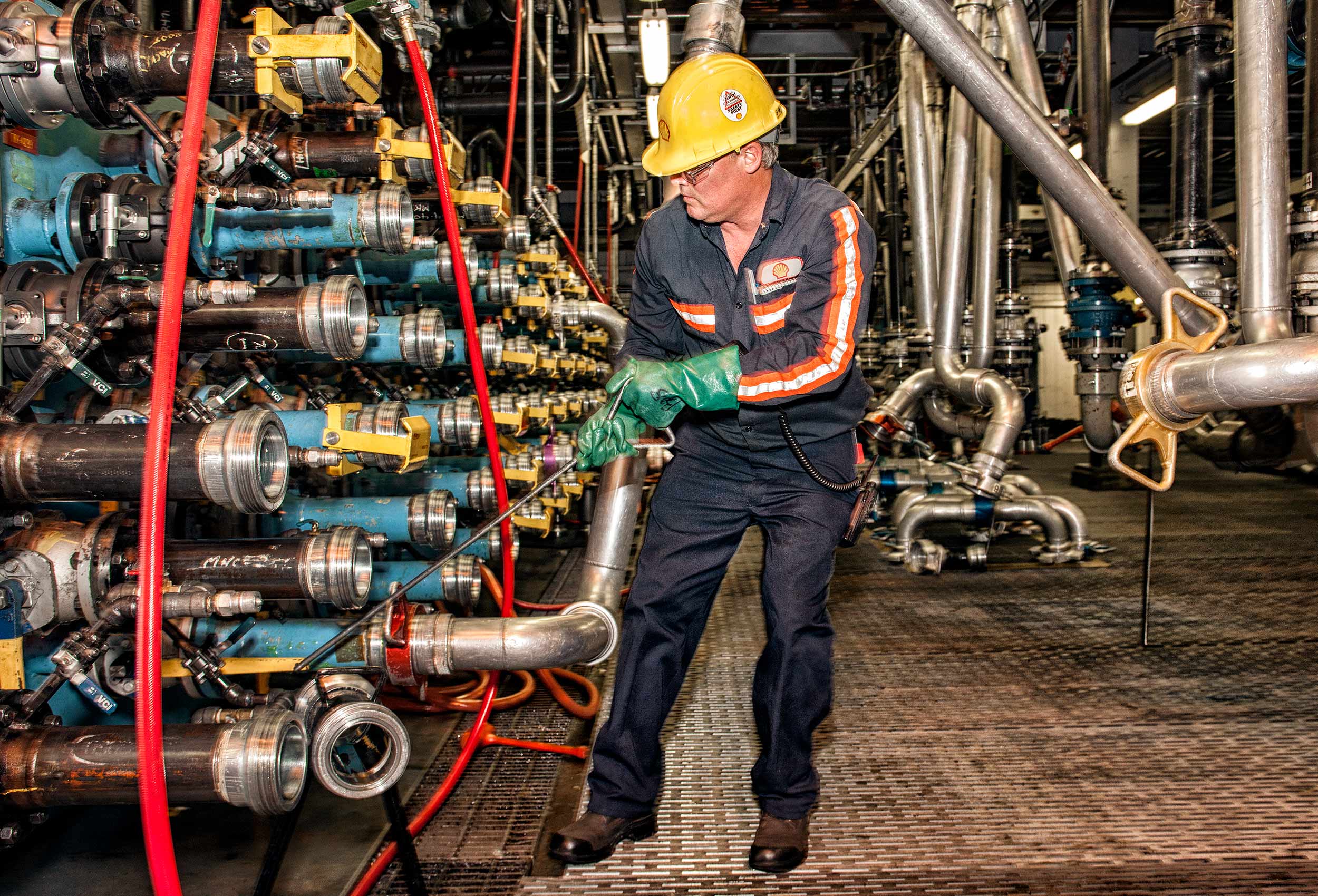 a shell canada employee at the brockville lubricants plant works with pipes