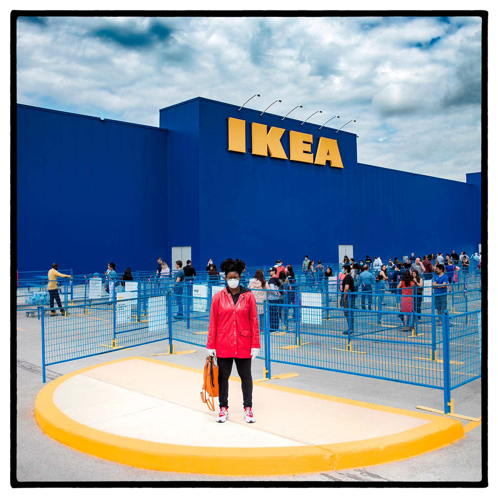 a shopper waits in a long line outside a toronto ikea store during the pandemic