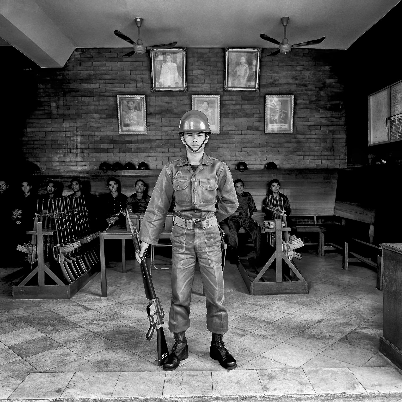 a-thai-soldier-stands-guard-at-the-entrance-to-the-thai-royal-palace-in-bangkok-thailand