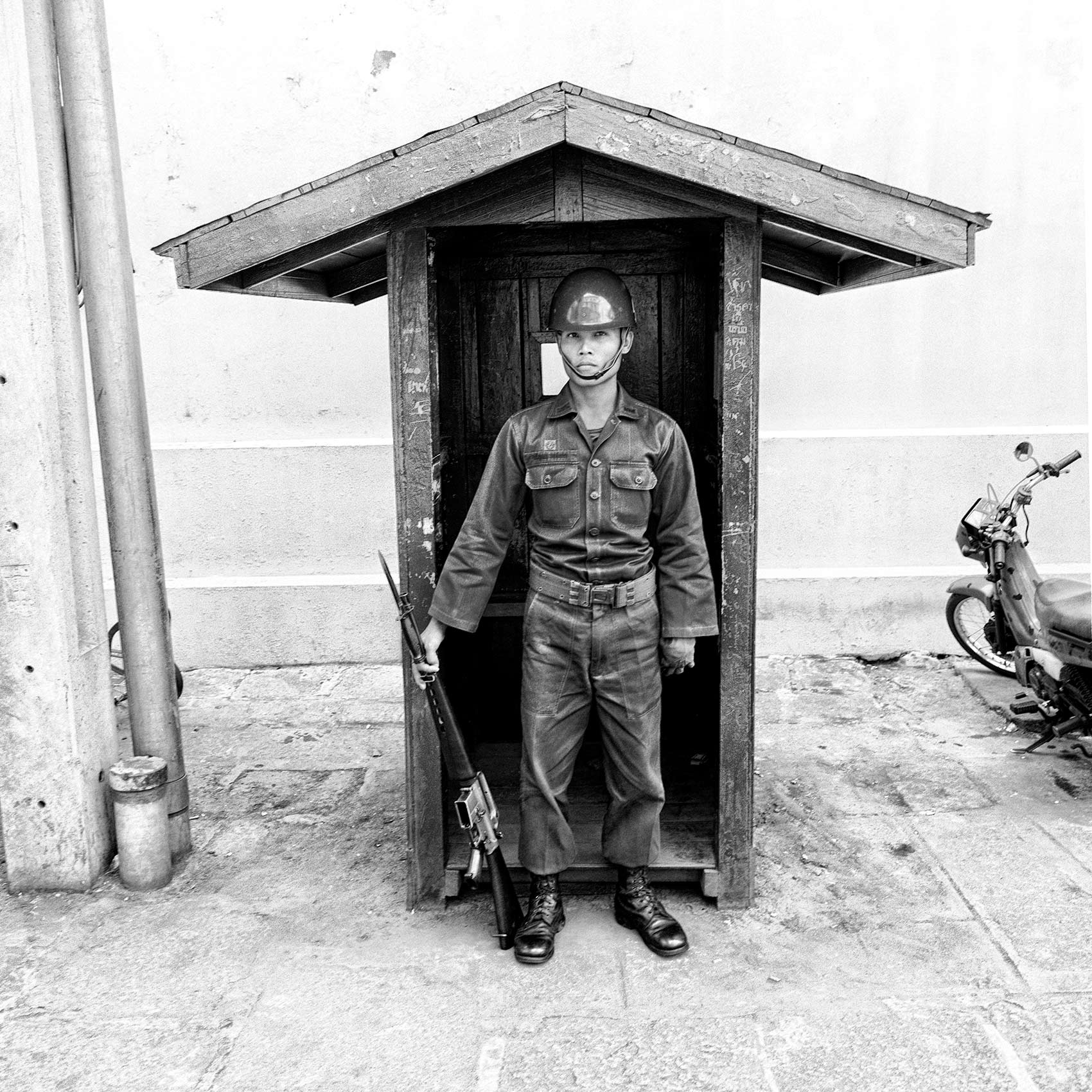 a-thai-soldier-stands-on-guard-outside-the-royal-palace-in-bangkok-thailand