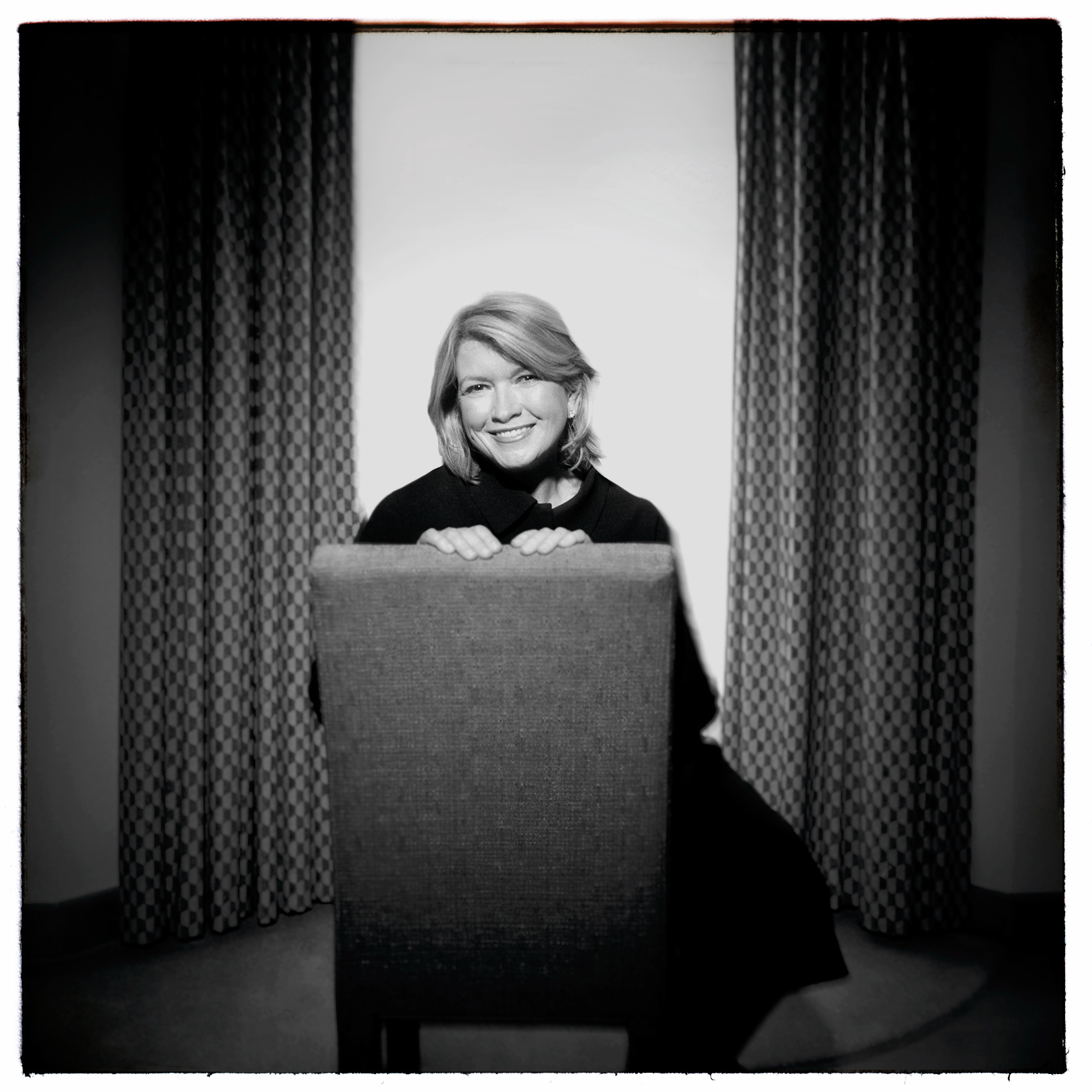 celebrity chef martha stewart smiles as she sits in a chair in a toronto hotel room