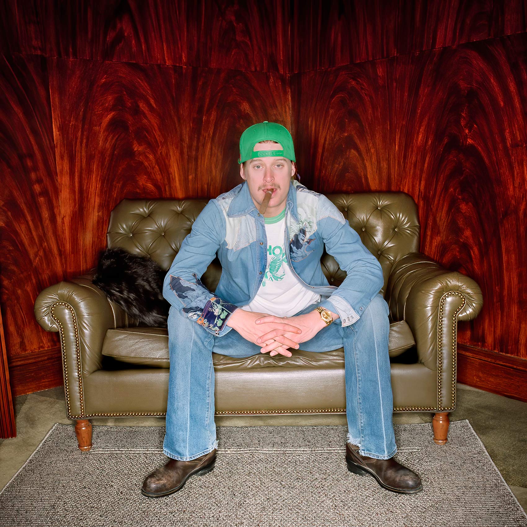 musican kid rock smokes a cigar during a celebrity portrait session in toronto 