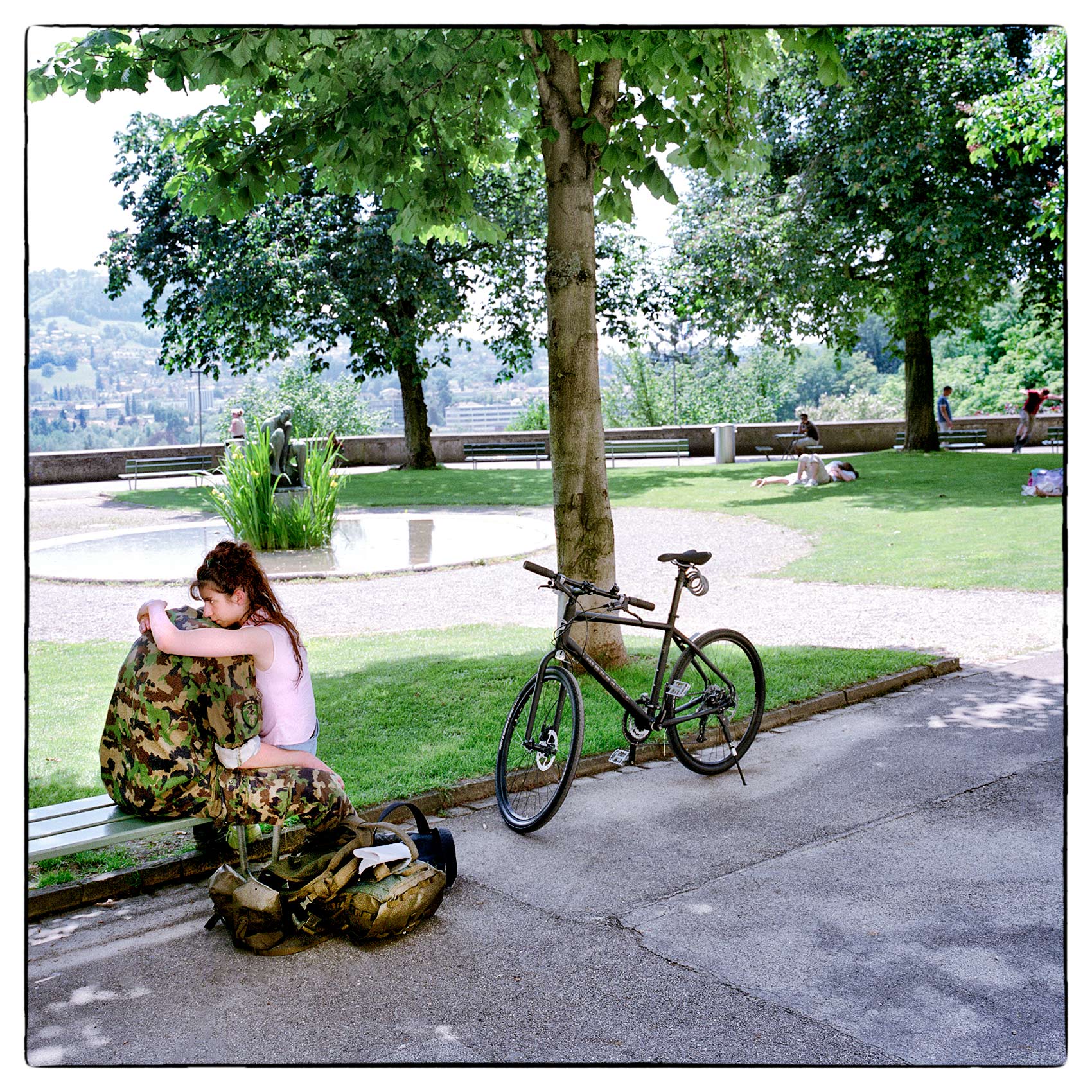 a-woman-hugs-her-boyfriend-before-he-leaves-for-duty-at-a-park-in-geneva-switzerland