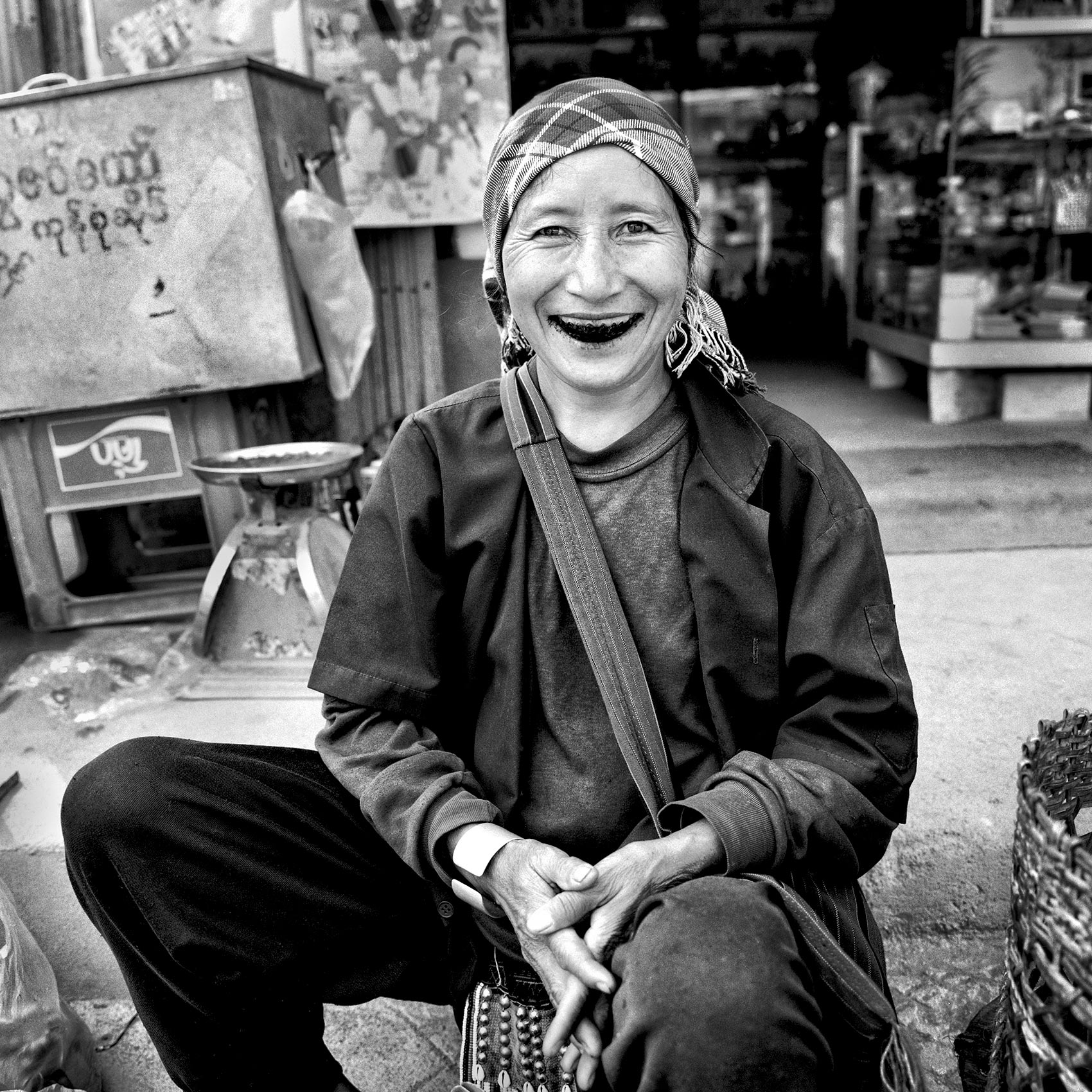 a-woman-in-an-myanmar-village-smiles-showing-her-dark-teeth-stained-by-betel-nut-chew-which-is-made-of-the-nut-and-tobacco