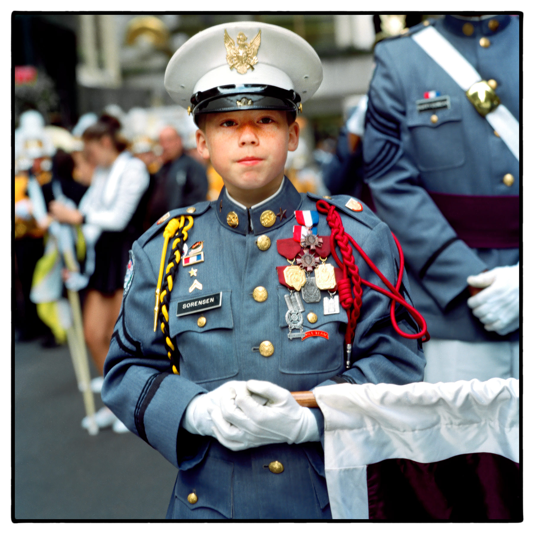 a-young-decorated-military-school-cadet-shows-off-his-medals-at-new-yorks-thanksgiving-day-parade