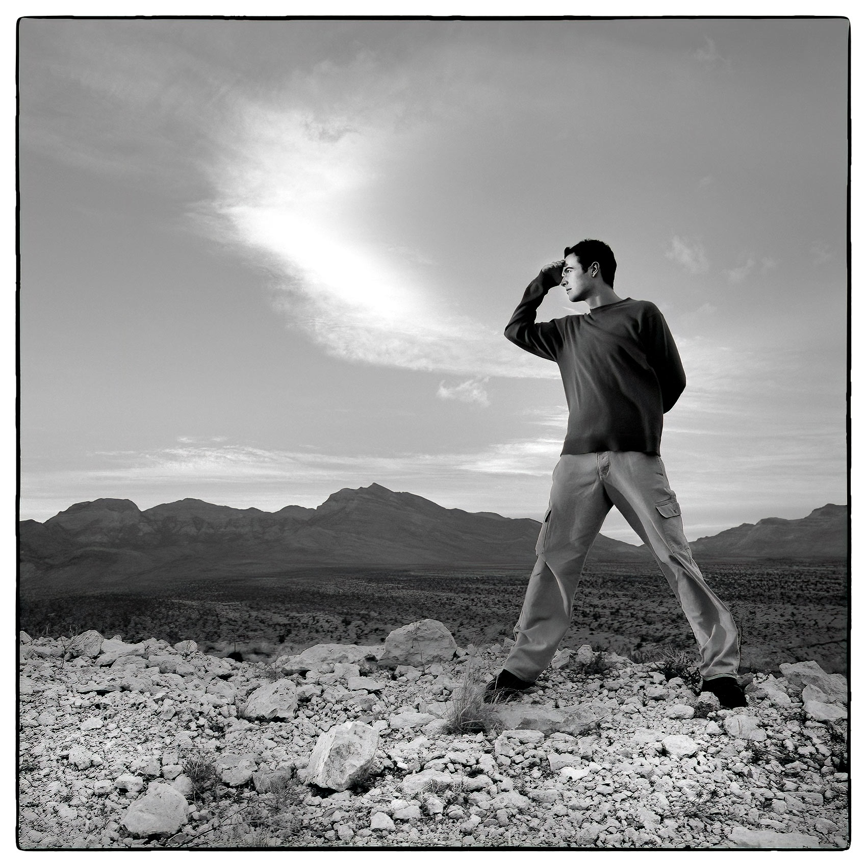 a-young-man-looks-out-over-the-nevada-desert-outside-of-las-vegast
