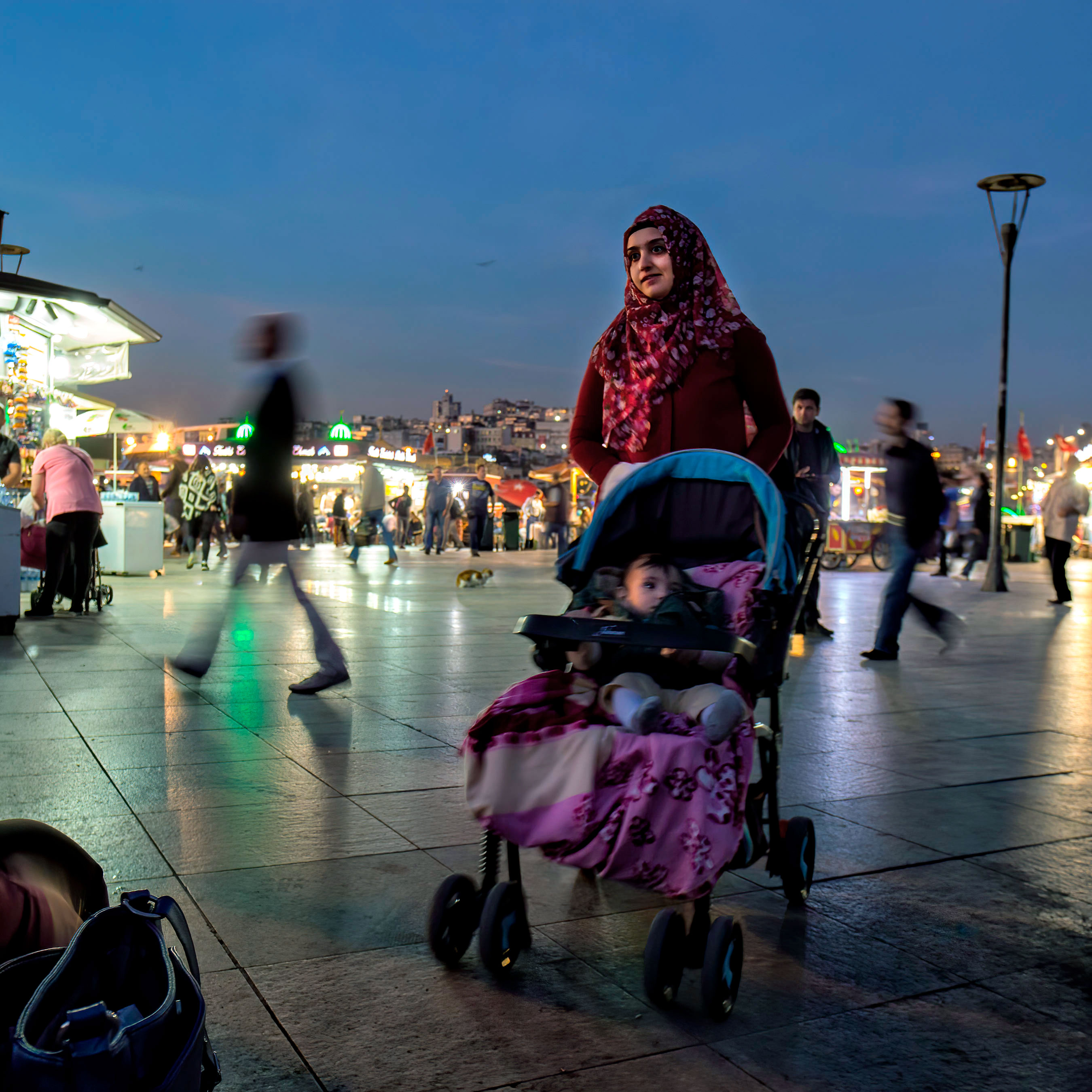 a-young-woman-and-her-baby-in-istanbuls-eminonu-bazaar-district