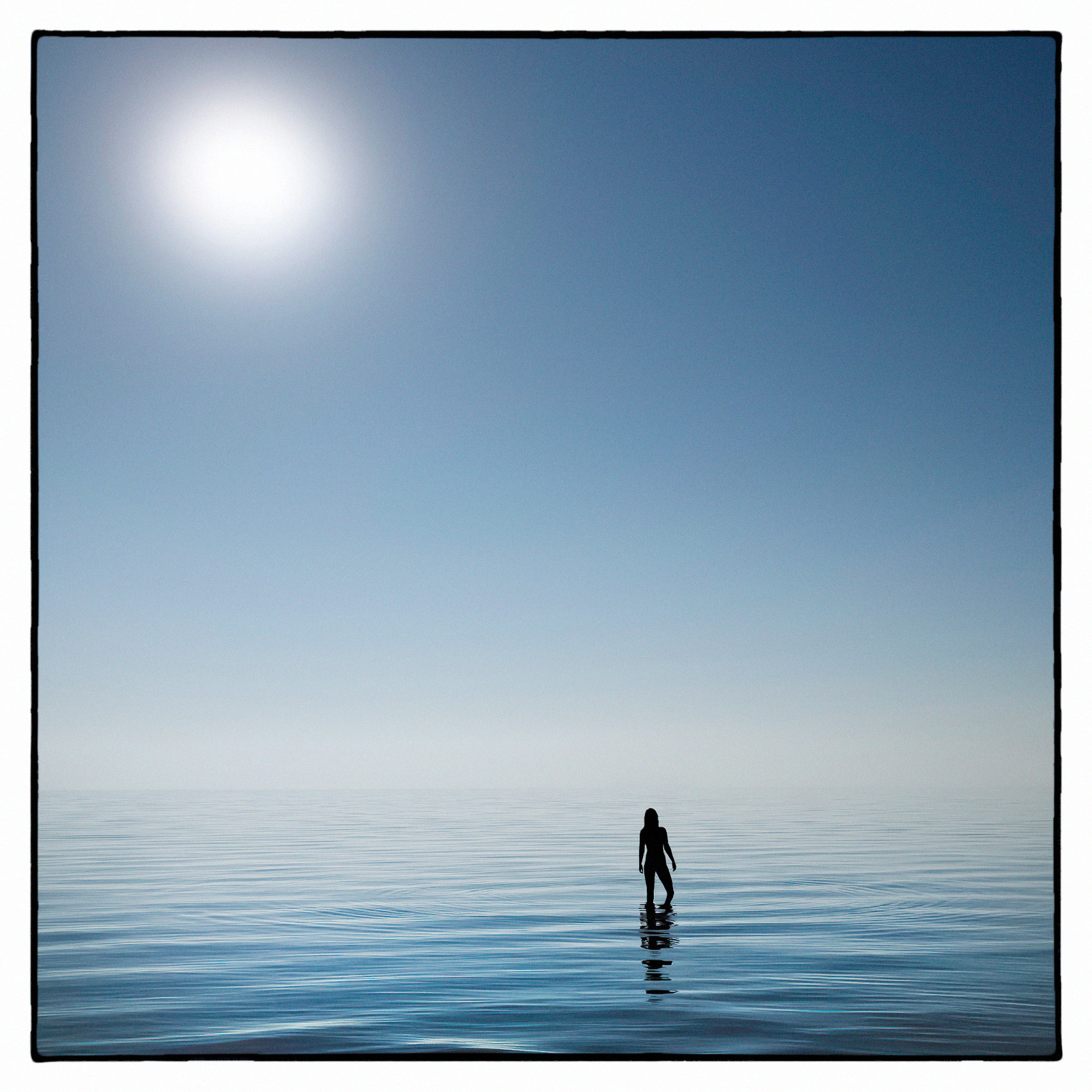 an-editorial-photo-of-a-naked-silouetted-woman-standing-in-the-water-at-hanlans-point-nude-beach-in-toronto