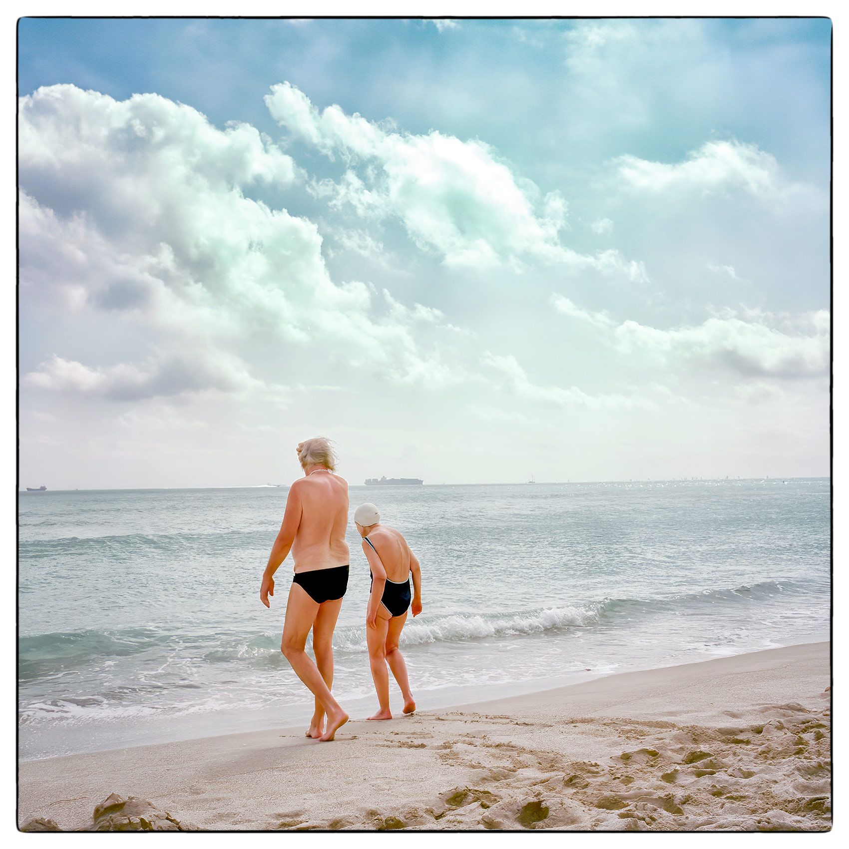 an-old-couple-go-for-a-swim-on-miami-beach-florida