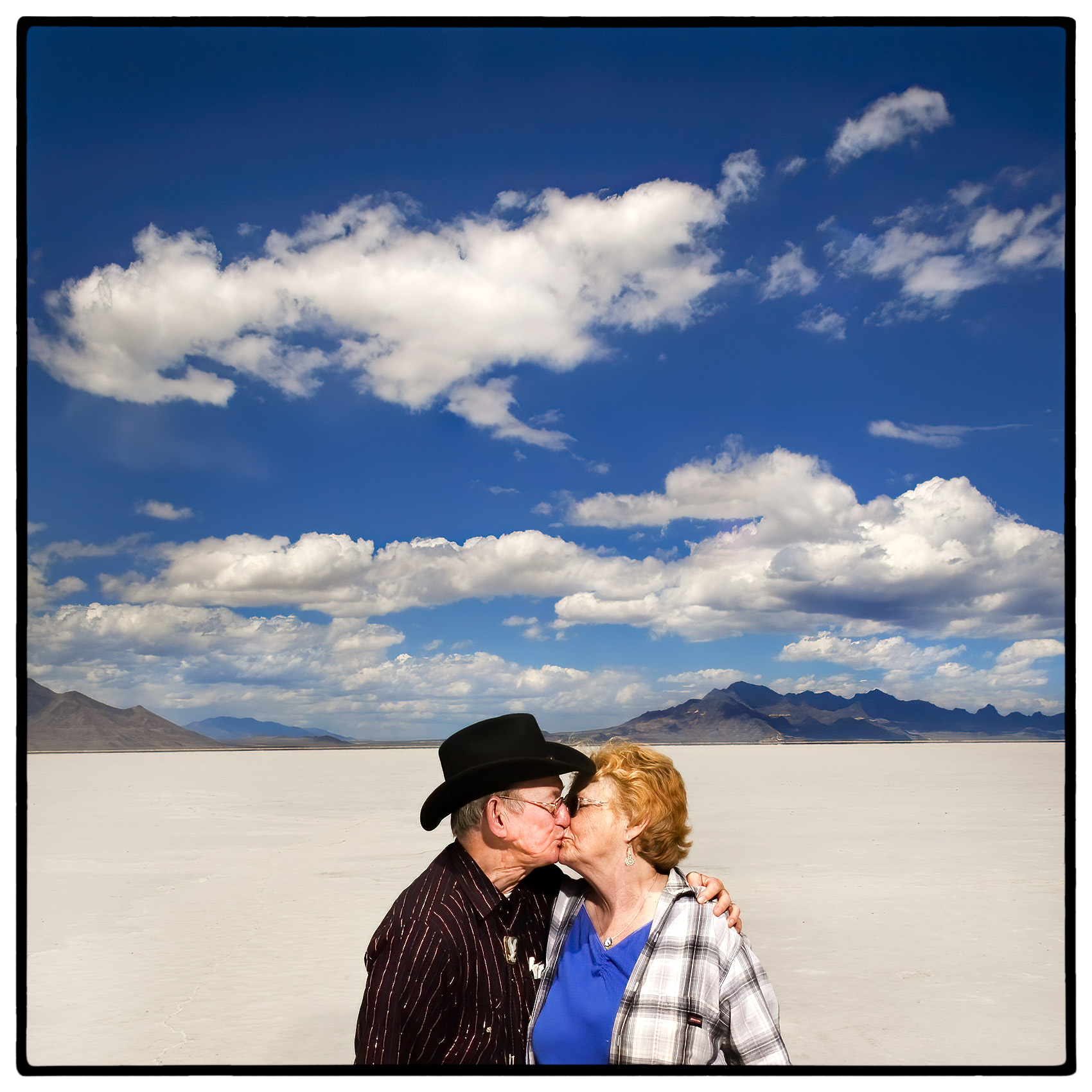 an-old-couple-kissing-in-the-scenic-bonneville-salt-flats