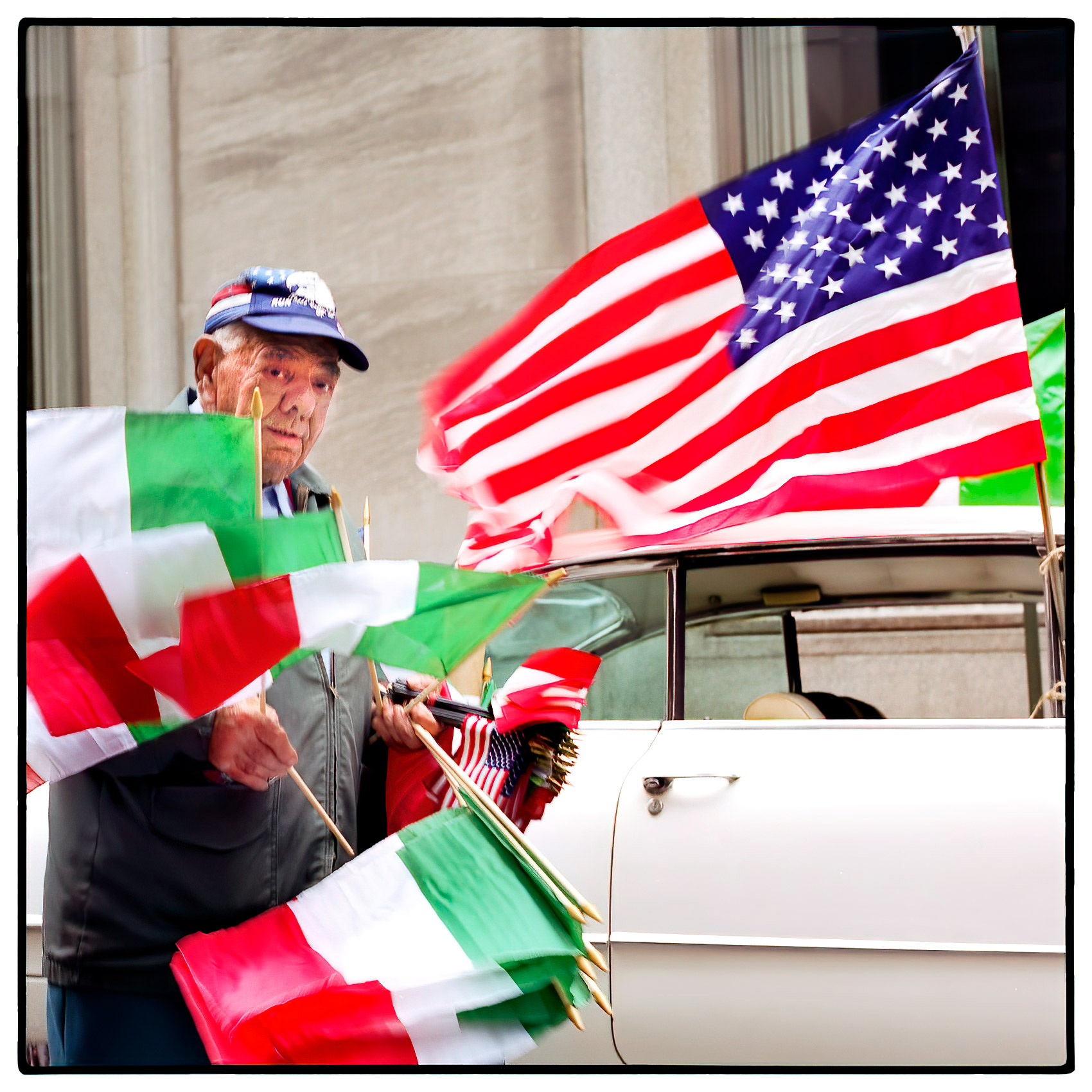 an-old-man-selling-flags-on-the-streets-during-the-new-york-thanksgiving-parade