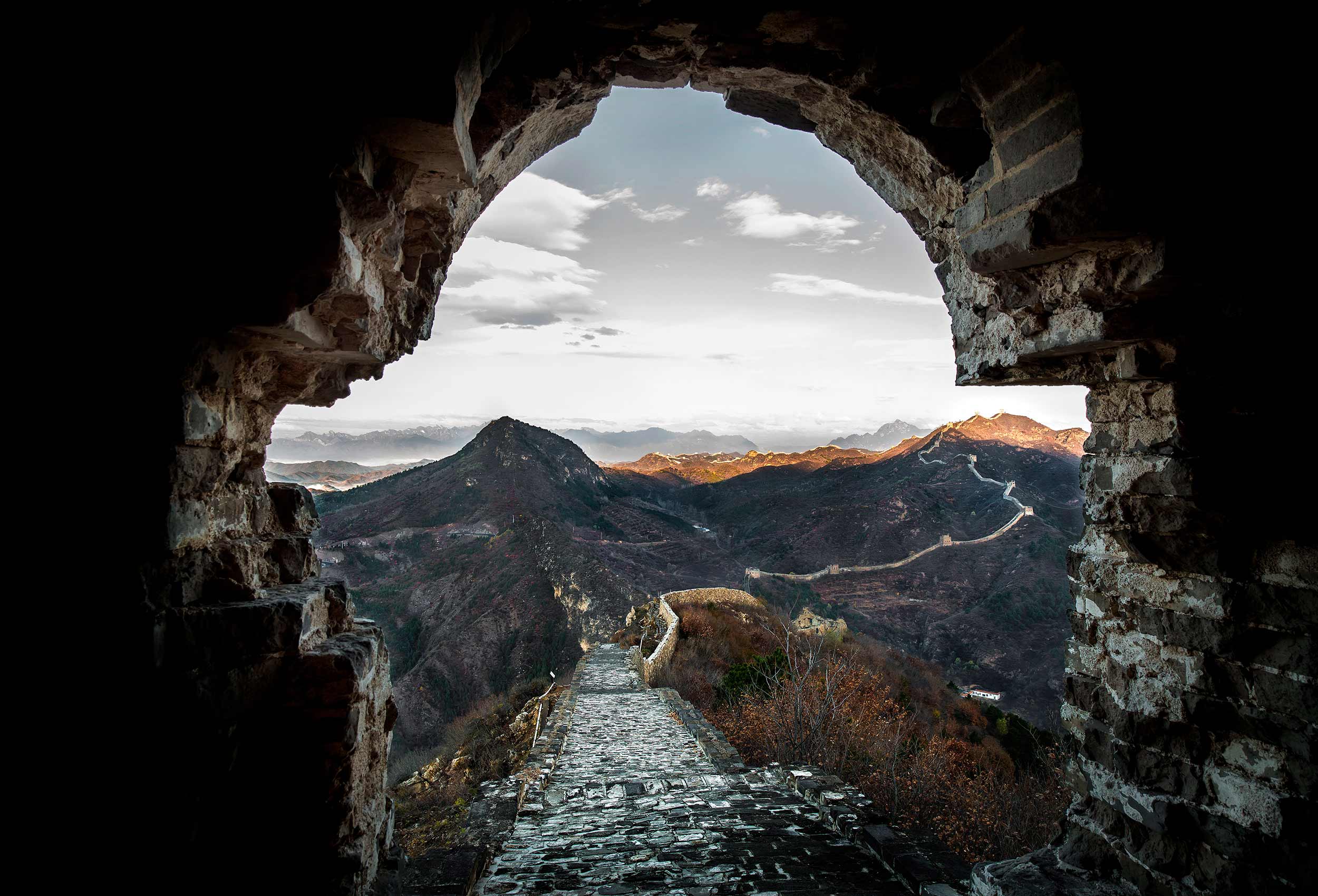 early morning sunrise over the great wall  of china by incredible travel photographer john hryniuk