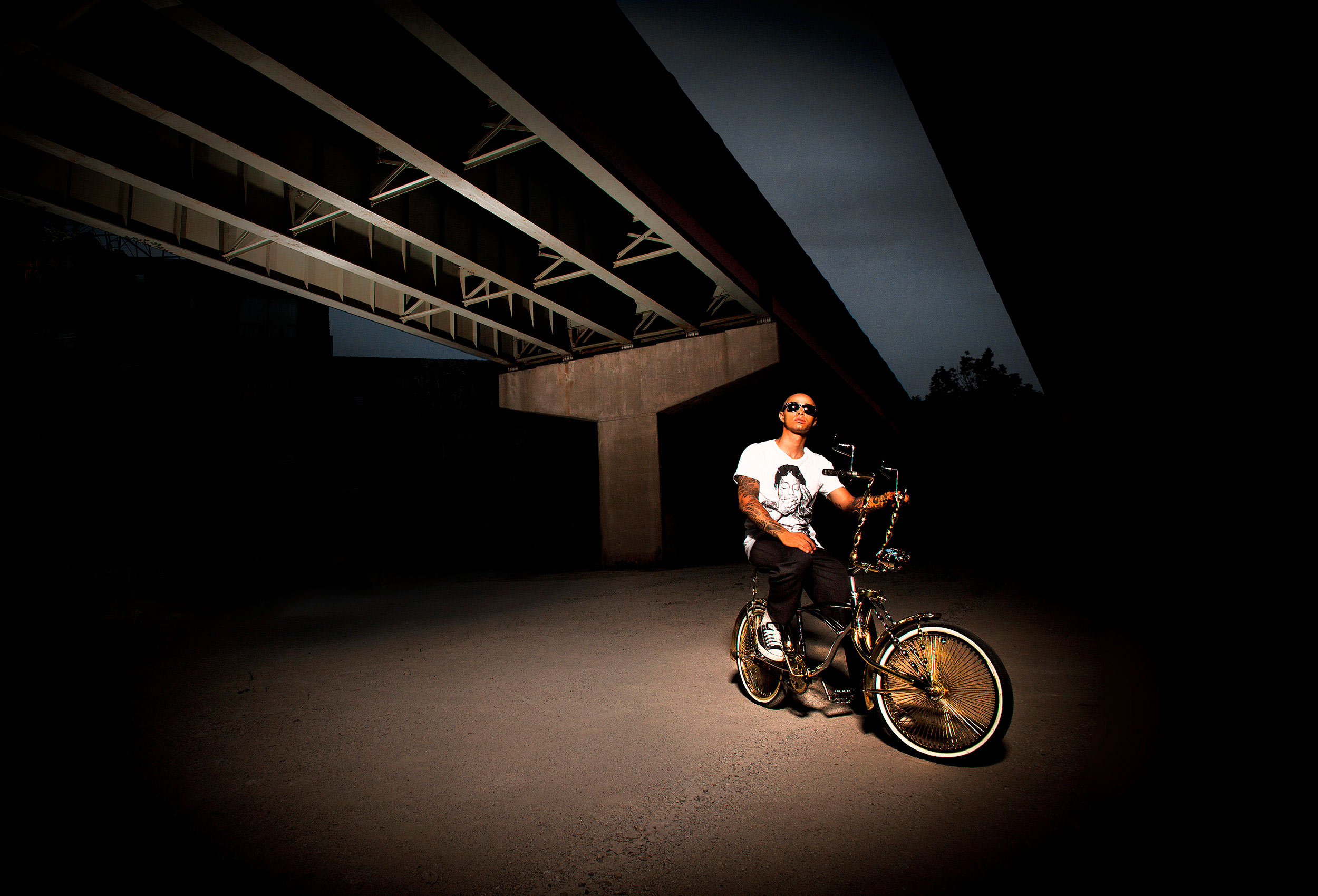a stylish portrait of a trick bike rider and his custom bicycle in toronto 