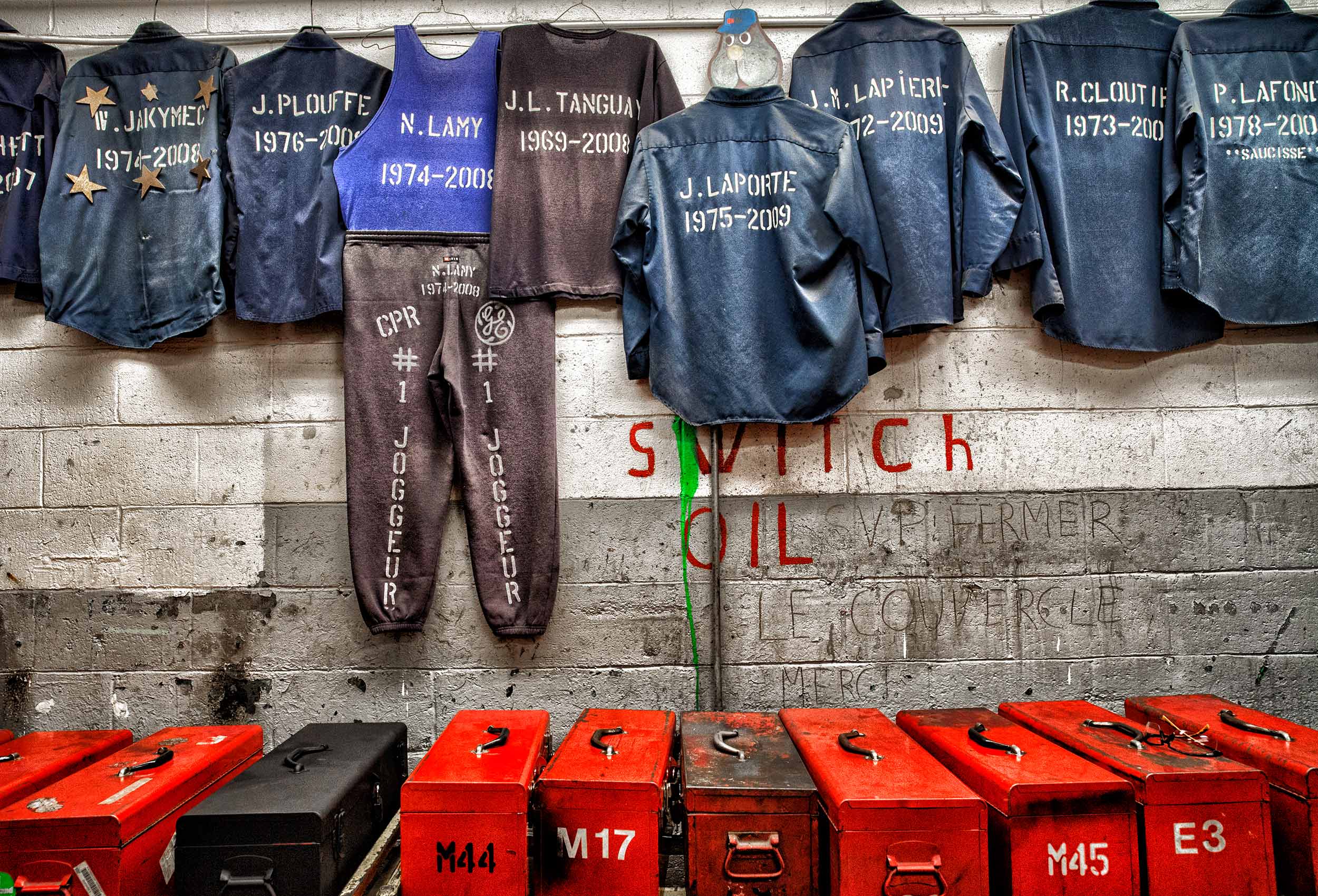 maintenance overalls from retired cp rail employees hang on a wall in their montreal change room