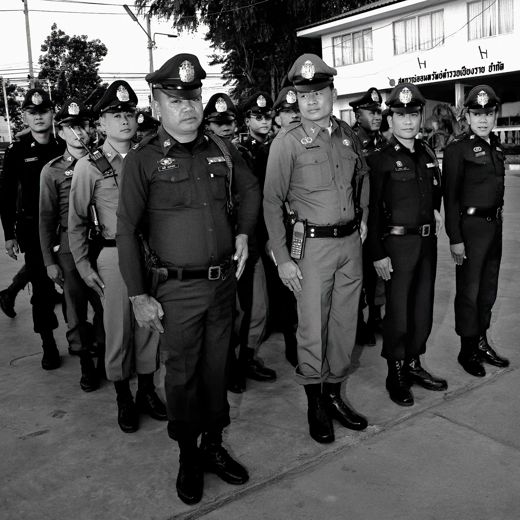 thai-officers-stand-at-attention-for-their-roll-call-at-a-police-station-in-chang-mai-thailand