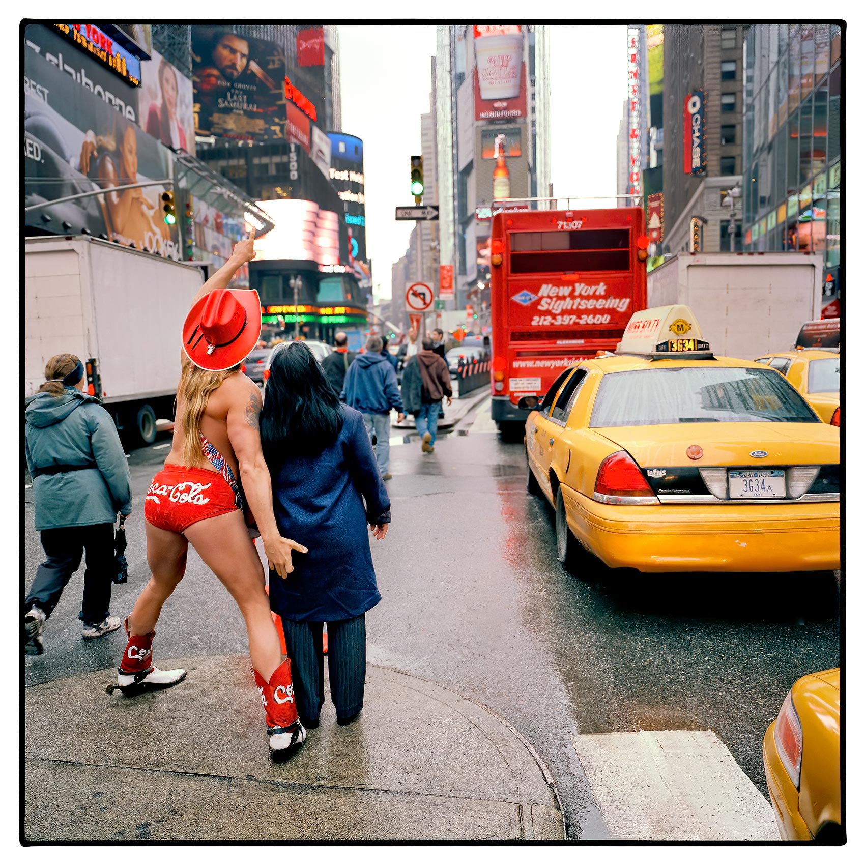 the-new-york-times-square-naked-cowboy-jokes-around-with-a-tourist-as-he-has-his-photo-taken