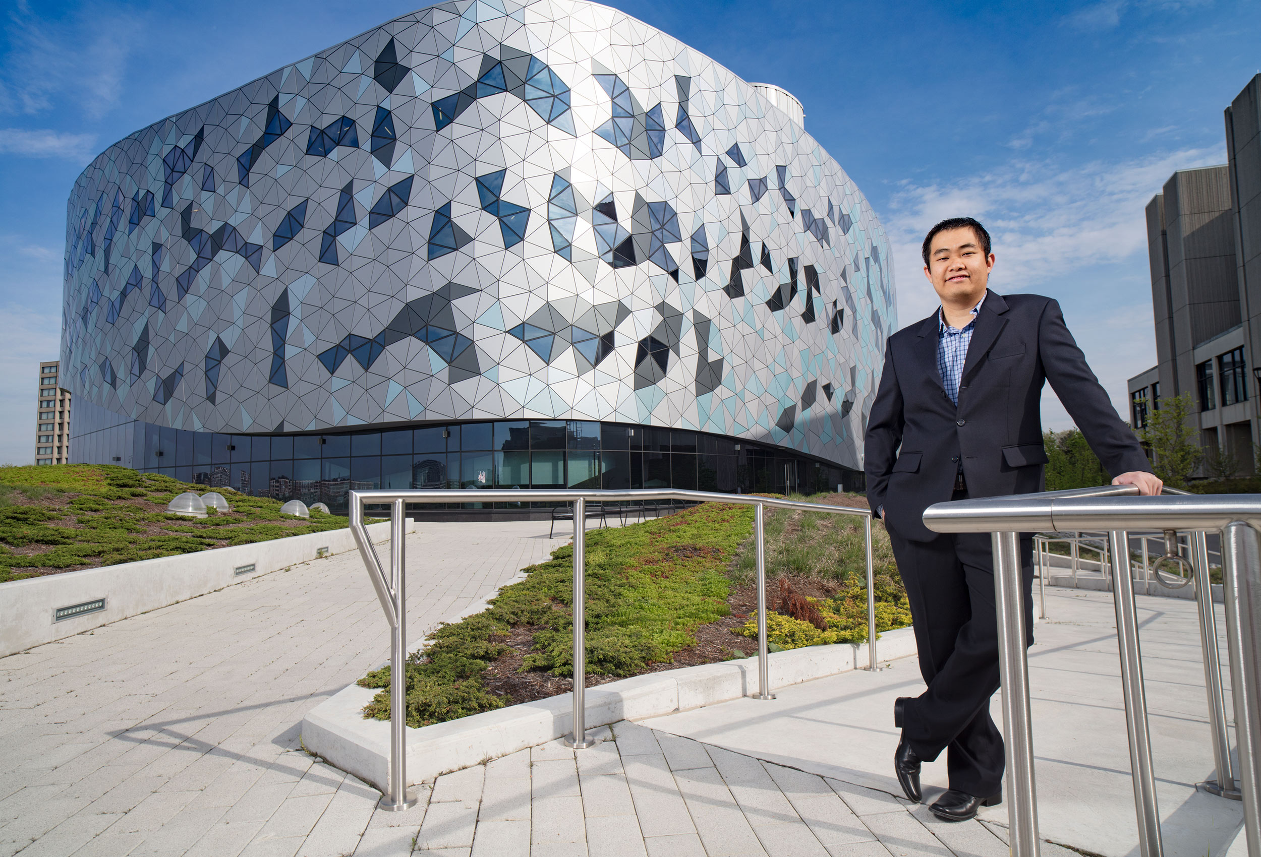 a photo of a student in front of the bergeron engineering buiding at york university