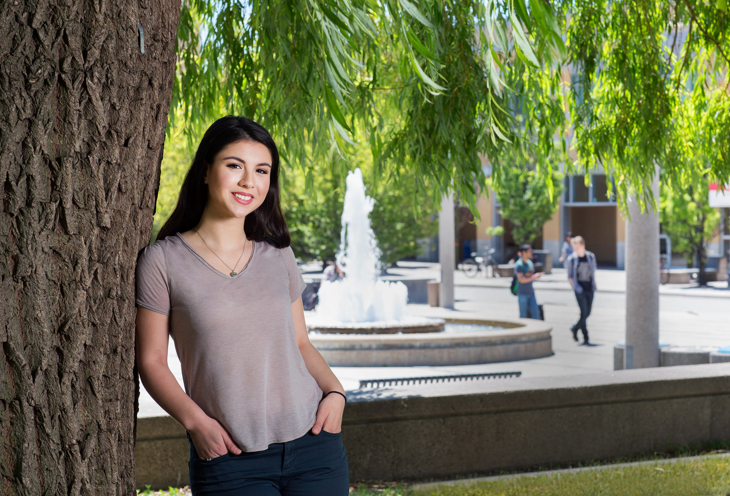 a york university student poses for a photo outside on the main campus by toronto photographer