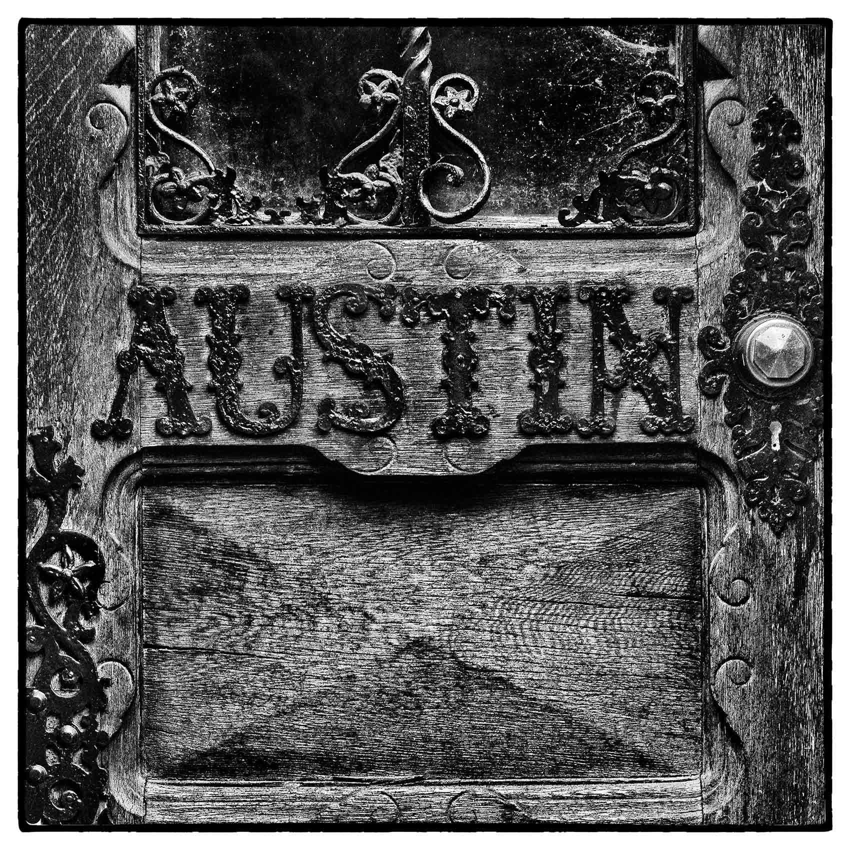 a Victorian crypt door with the name Austin on it at St. James Cemetery in Toronto